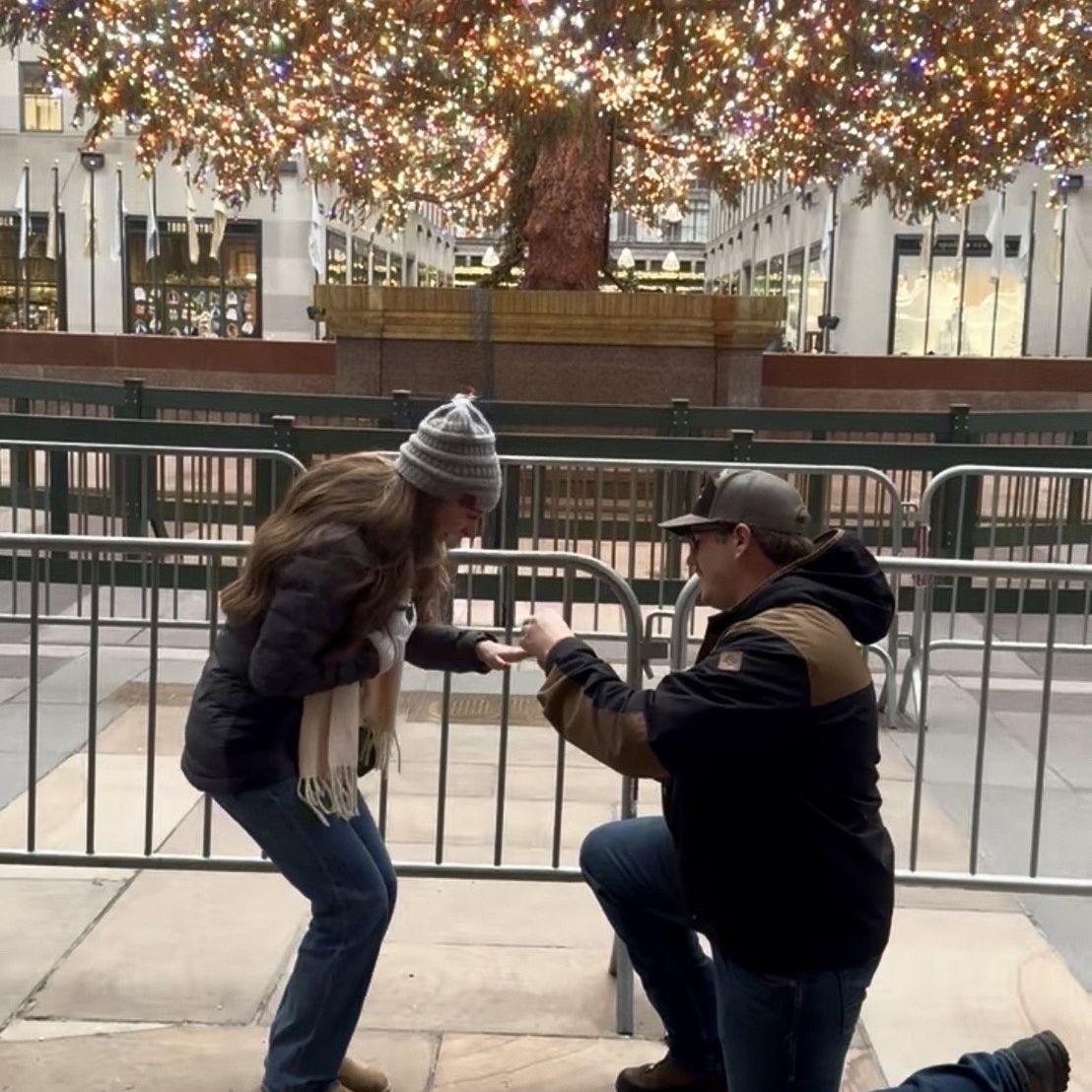 Wyatt proposes in front of Rockefeller Tree in NYC, 2025