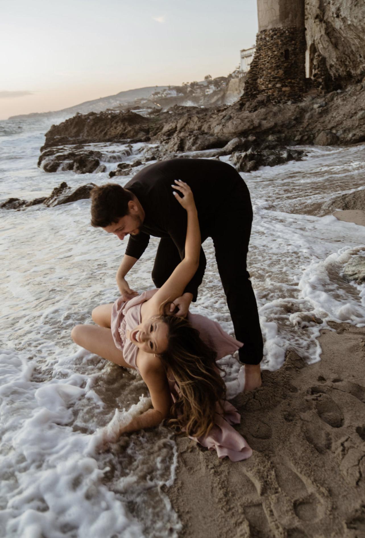 Just Andrei casually dropping me in the water during our engagement shoot! Victoria Beach, CA, March 2022