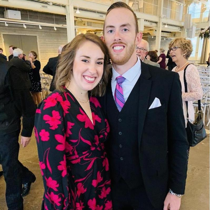 Our first photo together at a wedding 3 weeks after we met.