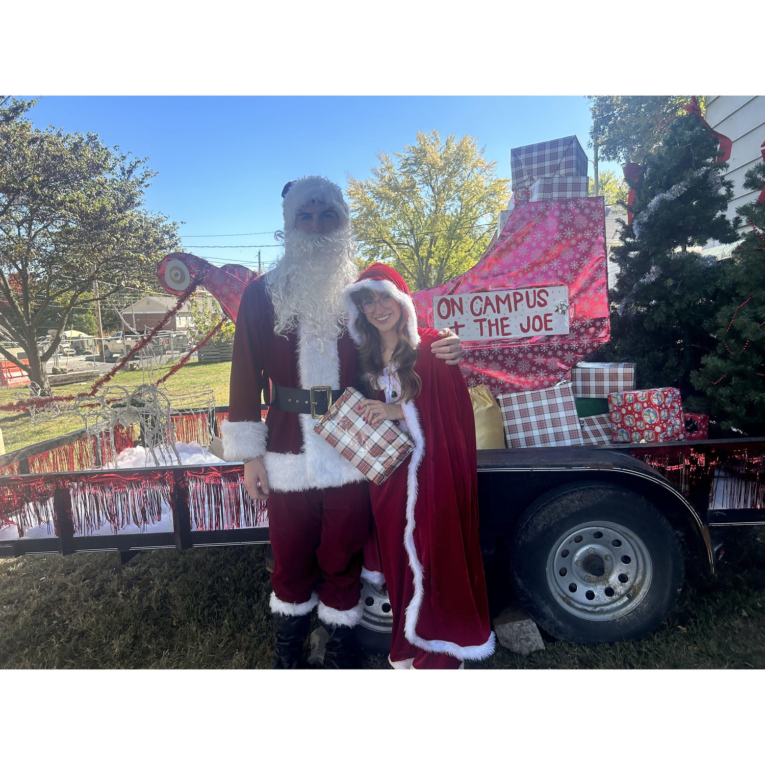 Being apart of the Benedictine on campus houses homecoming float as Santa and Mrs. Claus