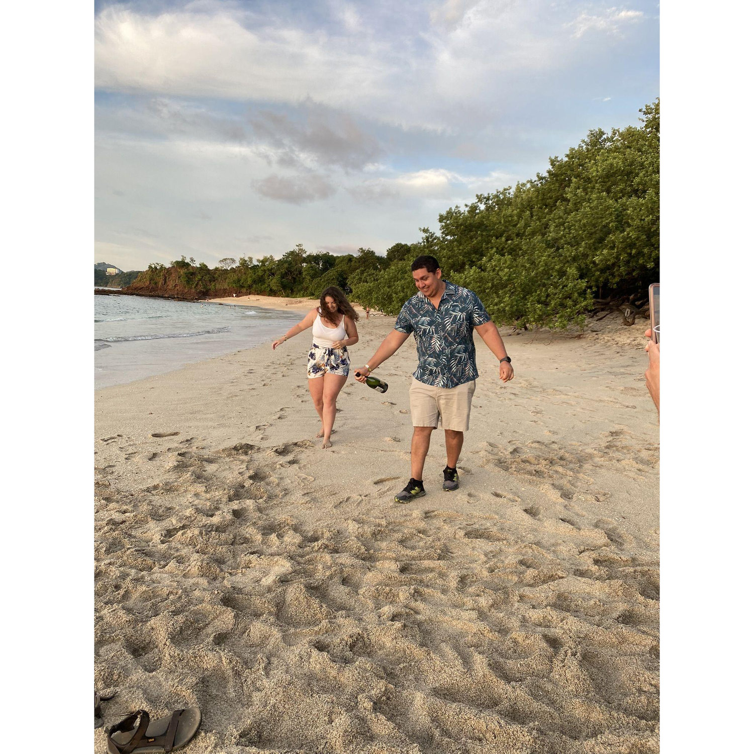 Champagne toasts during sunset in Costa Rica