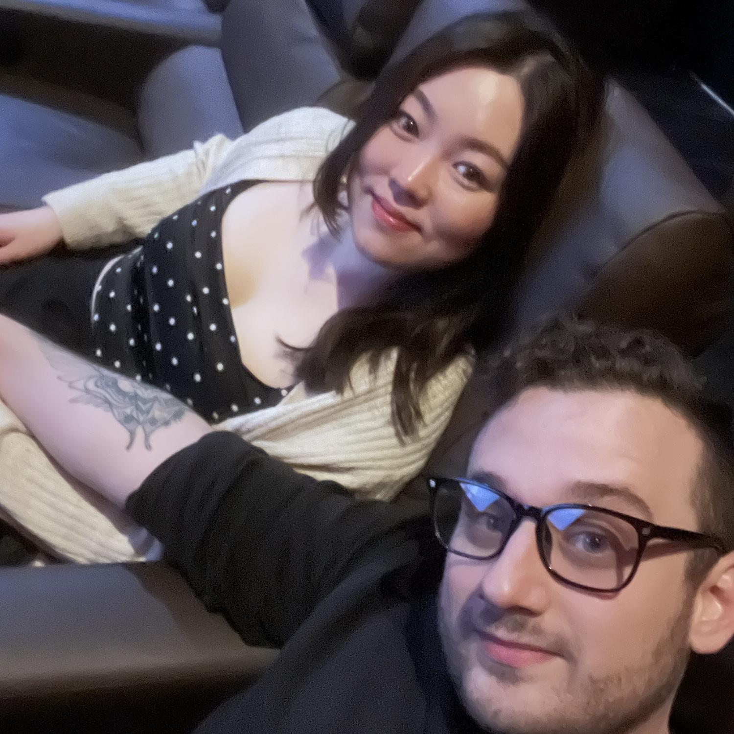 In a movie theater before seeing Poor Things. One of our favorite places to be 🙏🏼