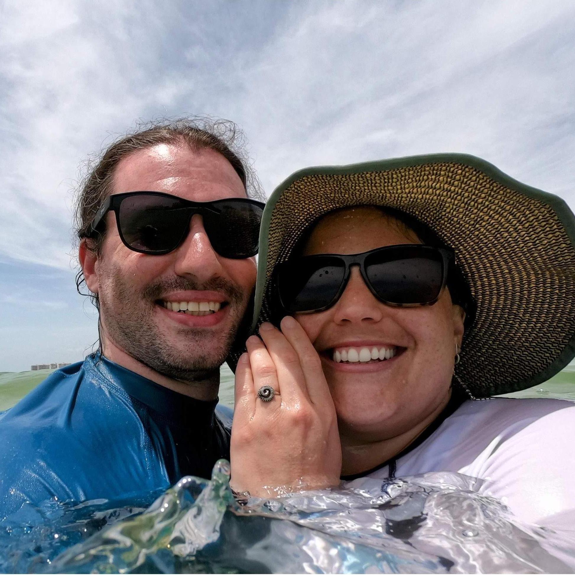 Peter proposed on a sandbar in the ocean