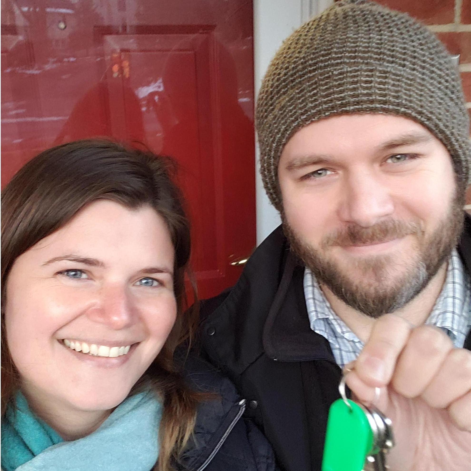 We bought a house! Note the reflection of our selfie in the door above our heads :)
