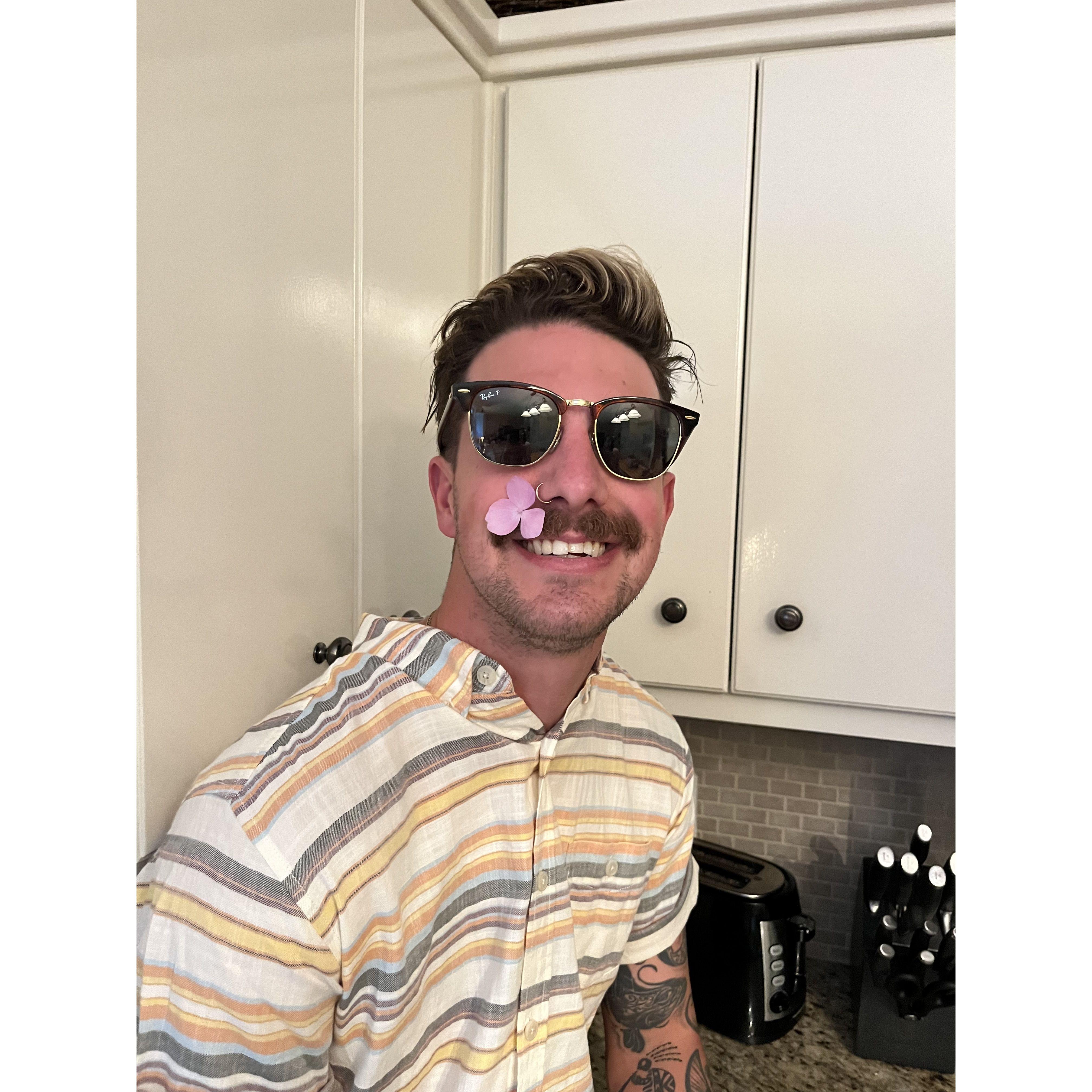 Embracing spring and his mustache.