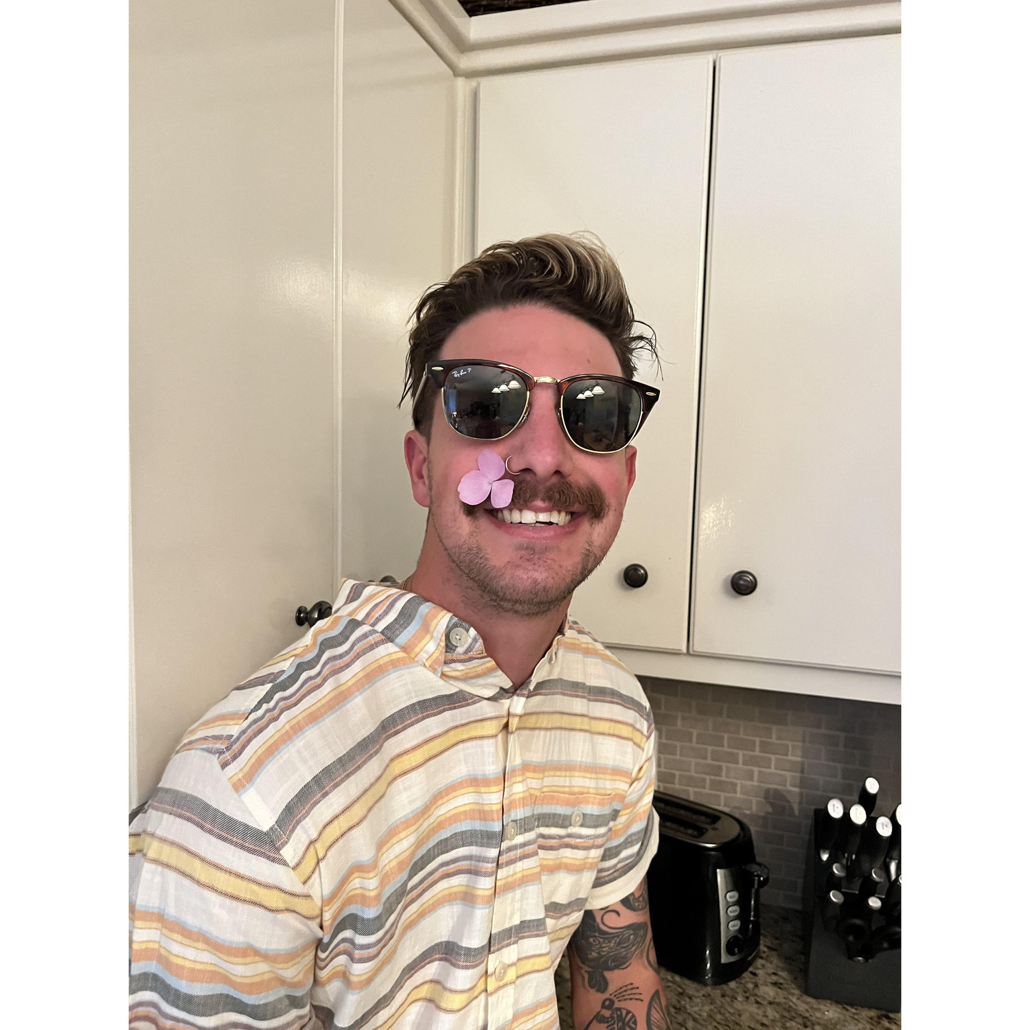 Embracing spring and his mustache.