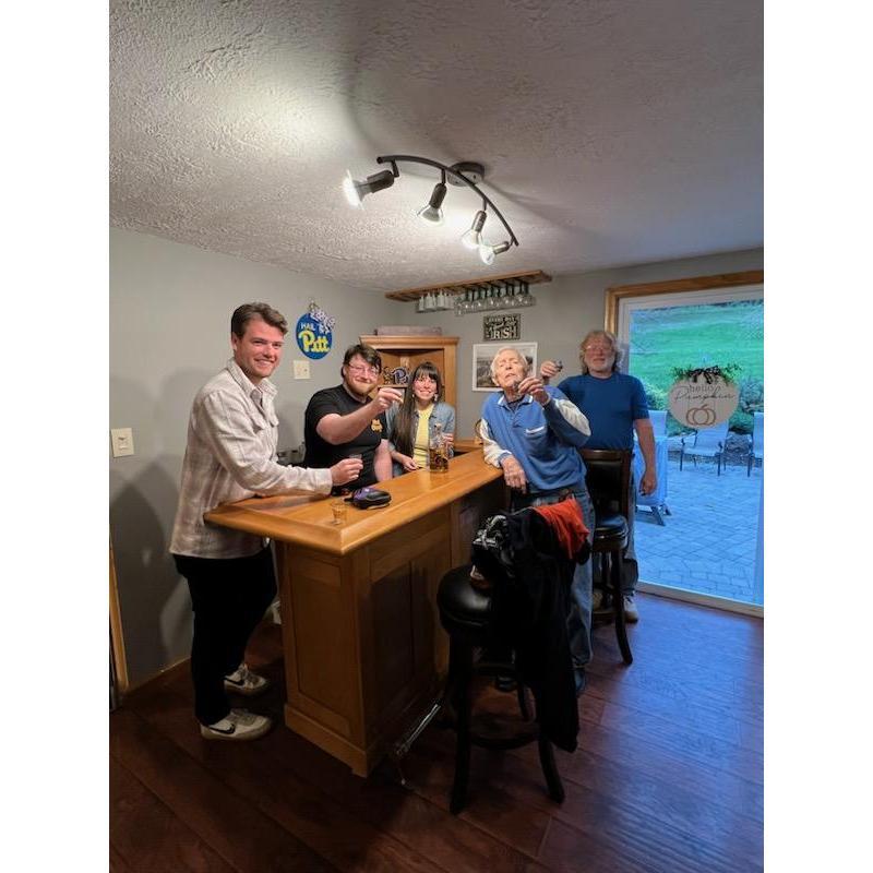 Grandpa Ruhl and family celebrating the new house.
