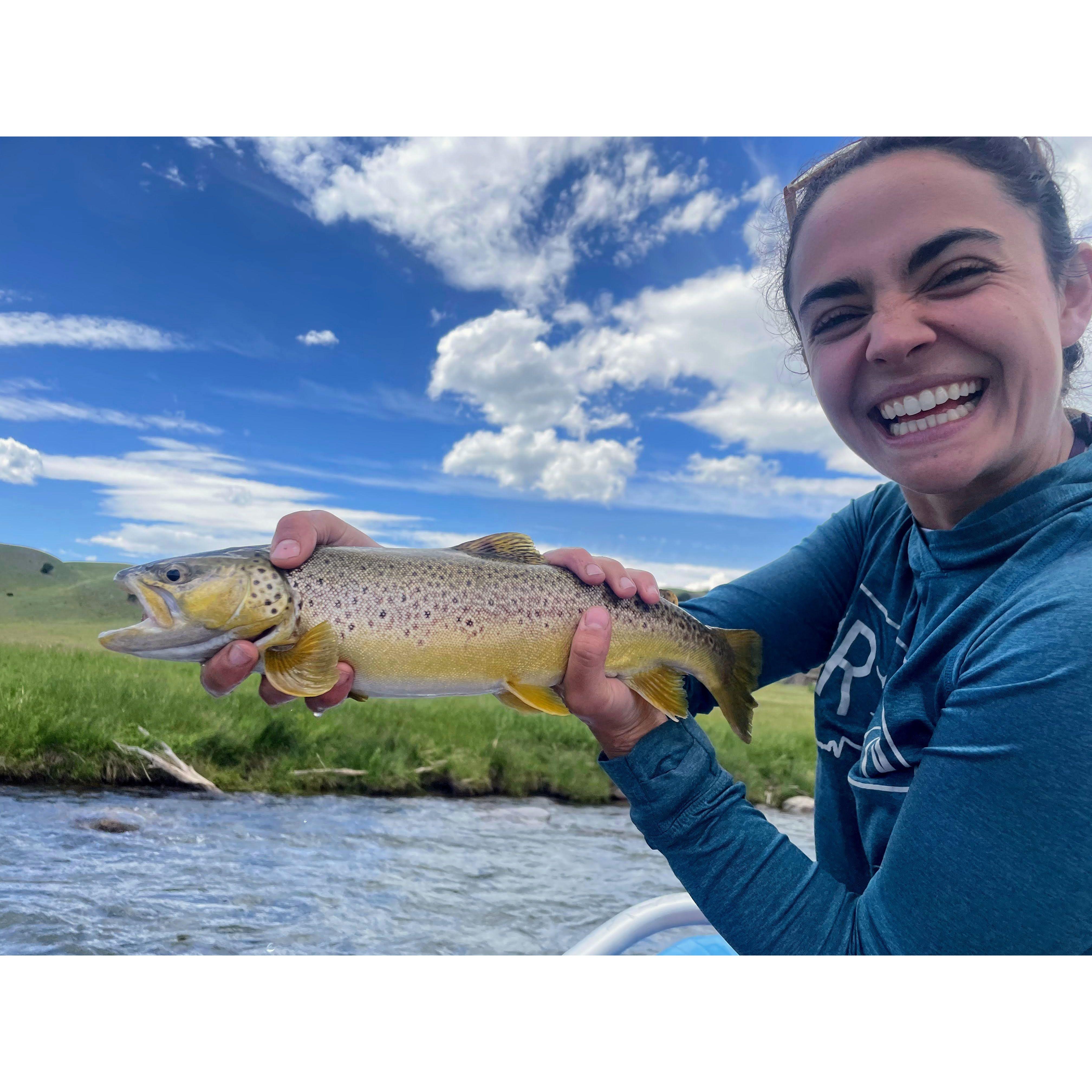 Jackie's first catch on a fly rod, facilitated by guide Spencer.