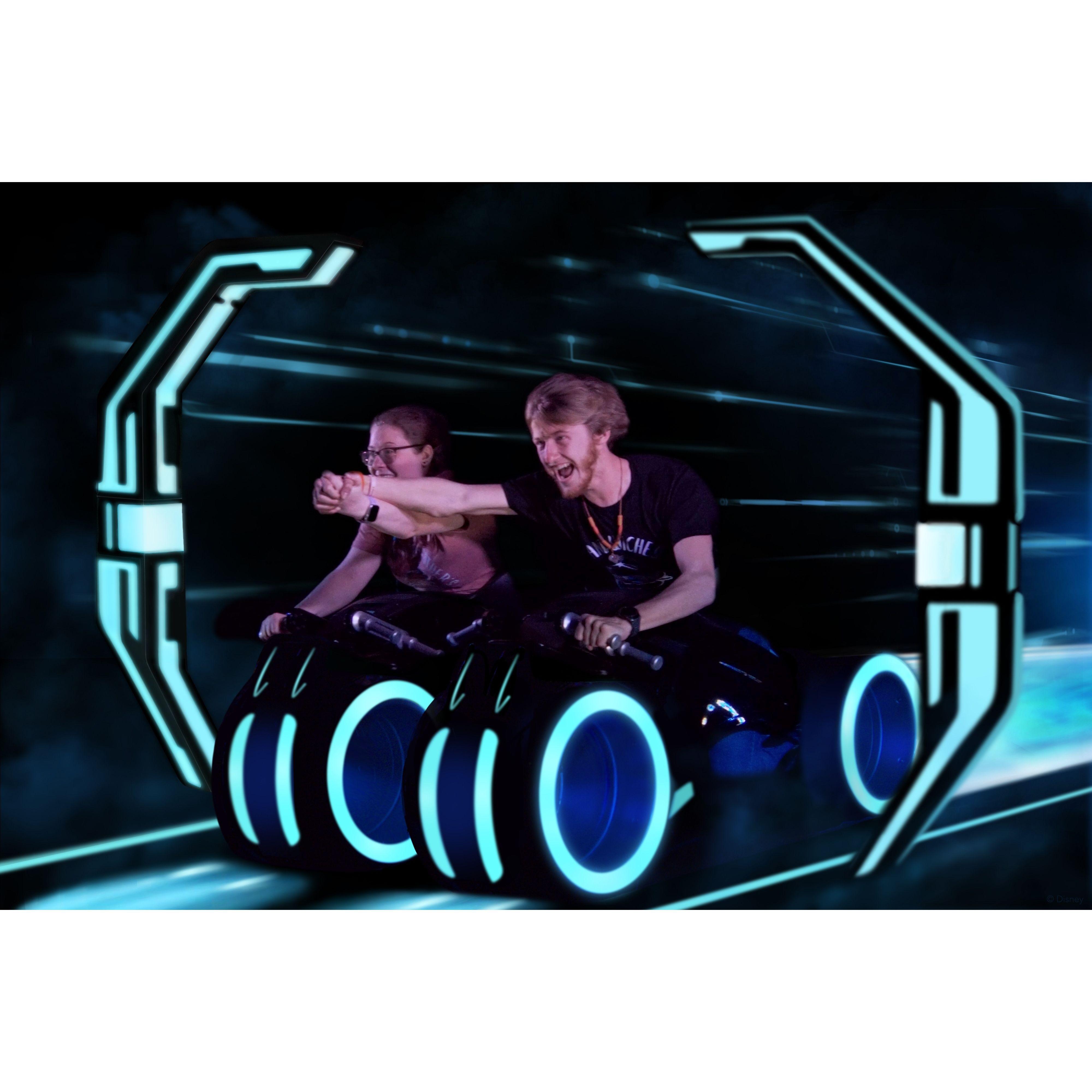 Riding Tron: Lightcycle Run during our first trip together to Magic Kingdom