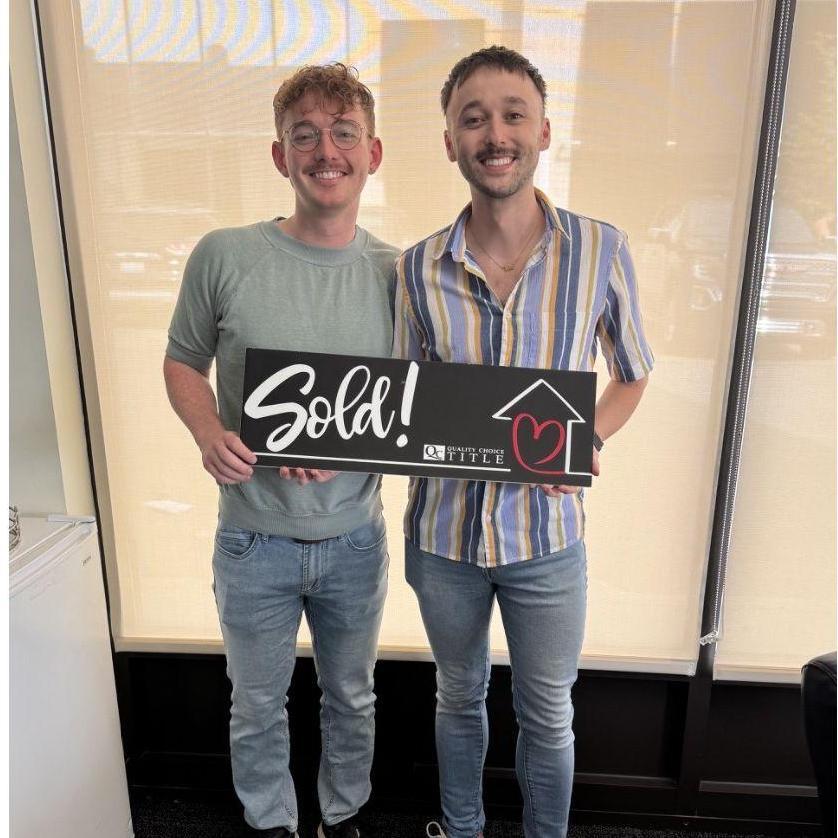 We got this cheesy pic after closing on our house