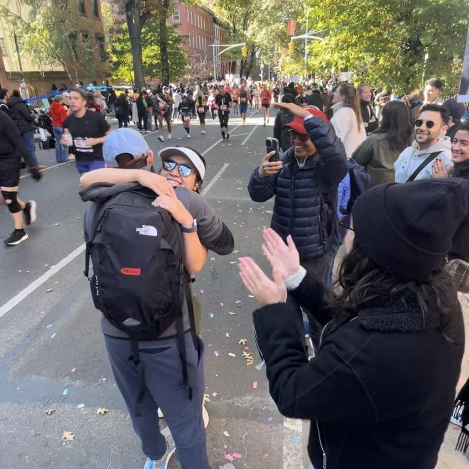 A warm embrace on DeKalb Avenue in the Fort Greene section of Brooklyn, during the 2024 NYC Marathon