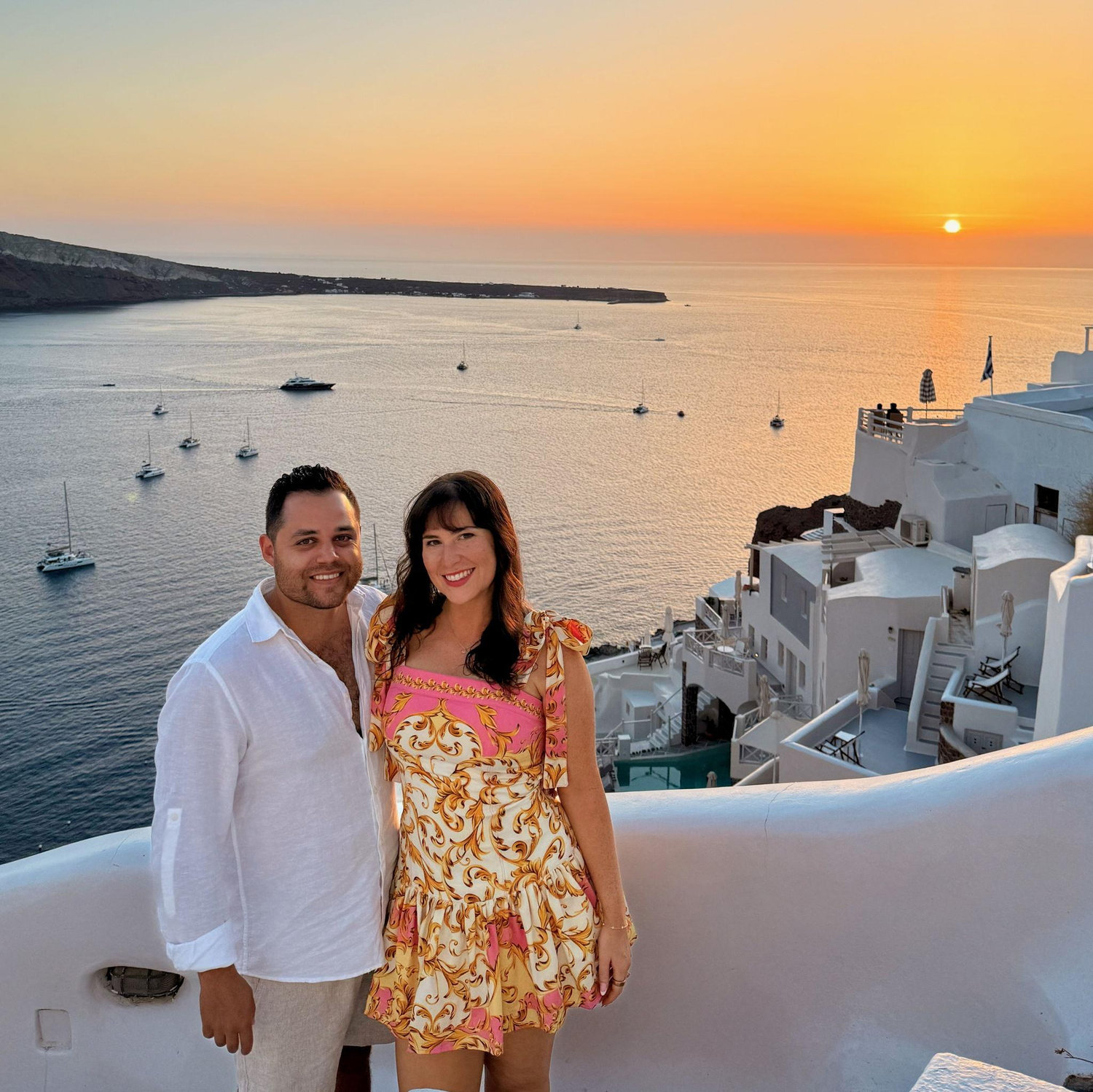 Enjoying the Santorini sunset together