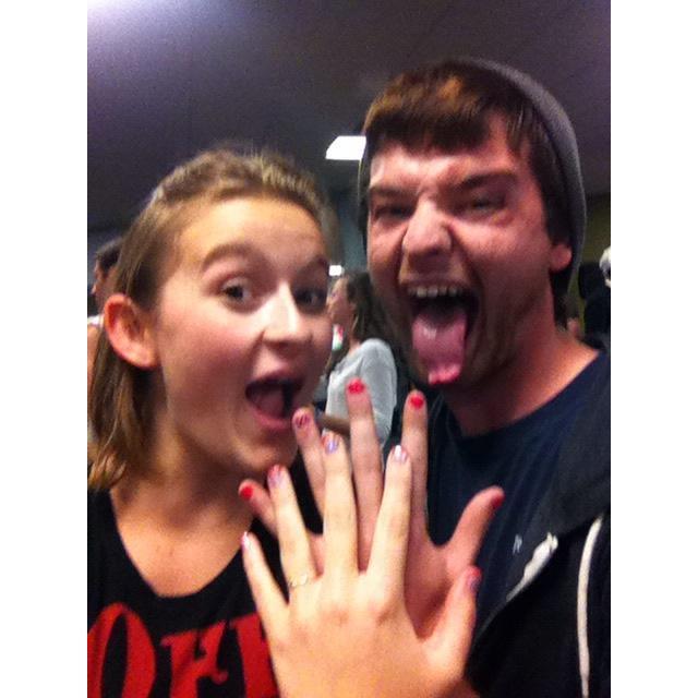 One of our very first photos together. Stress Relief Night at USM, Spring 2013. We were just friends then, but Caroline was still able to convince Owen to get his nails painted pink to match hers.