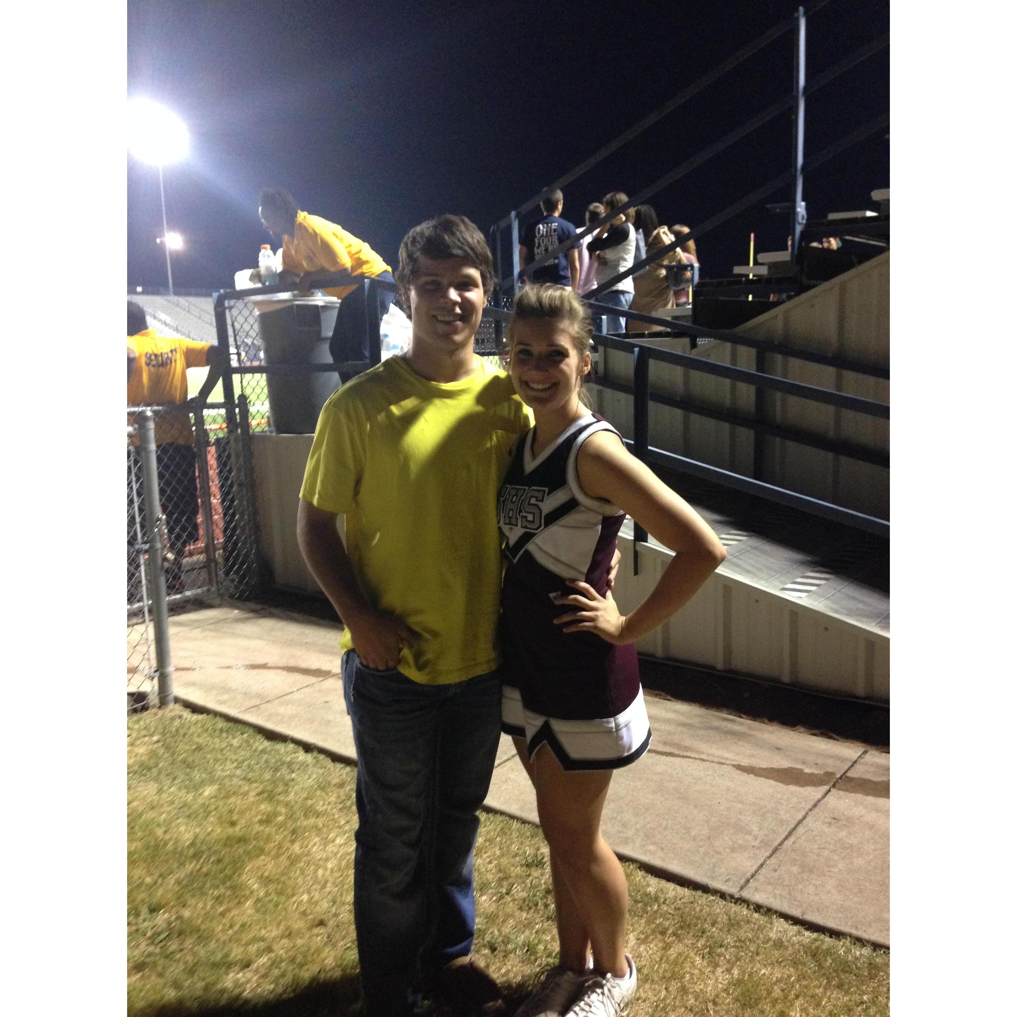 Our first picture together. Cole came to watch me cheer at a football game.