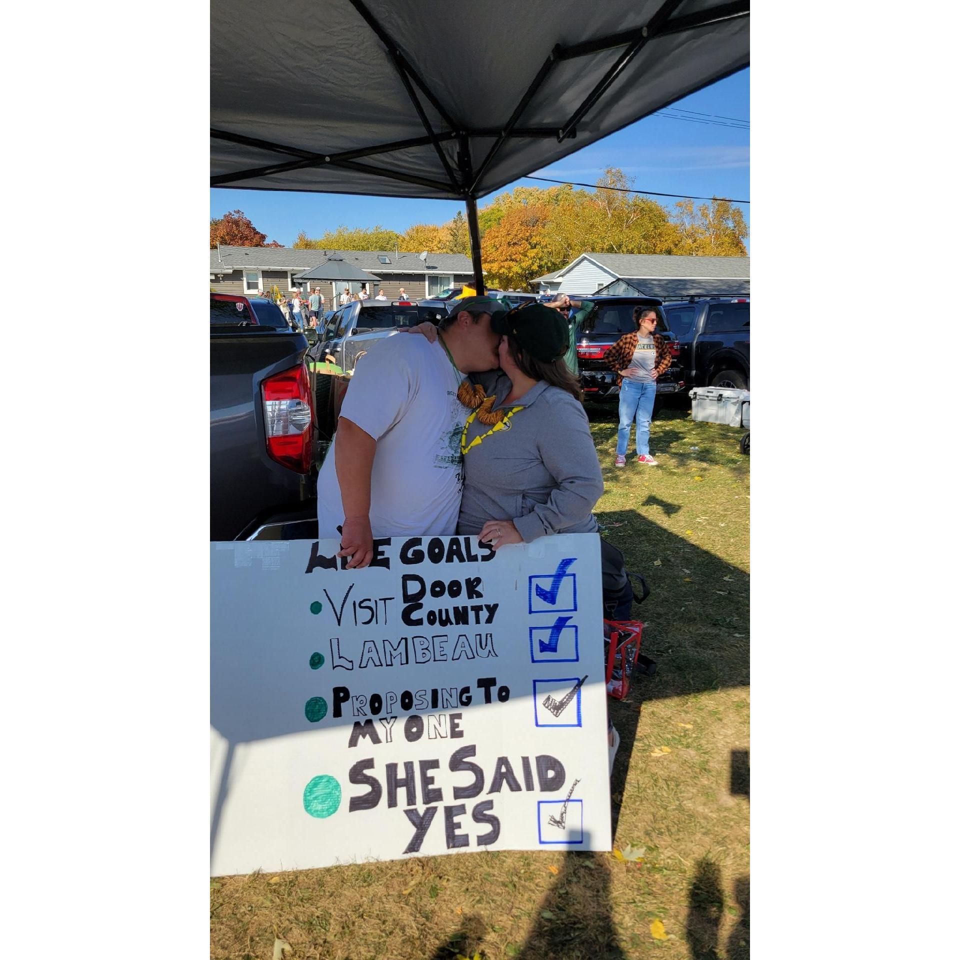 The story of the sign is for another day...  Tony surprised Marisa by proposing in Green Bay! This is where I sneak in a Go Pack Go ;-)