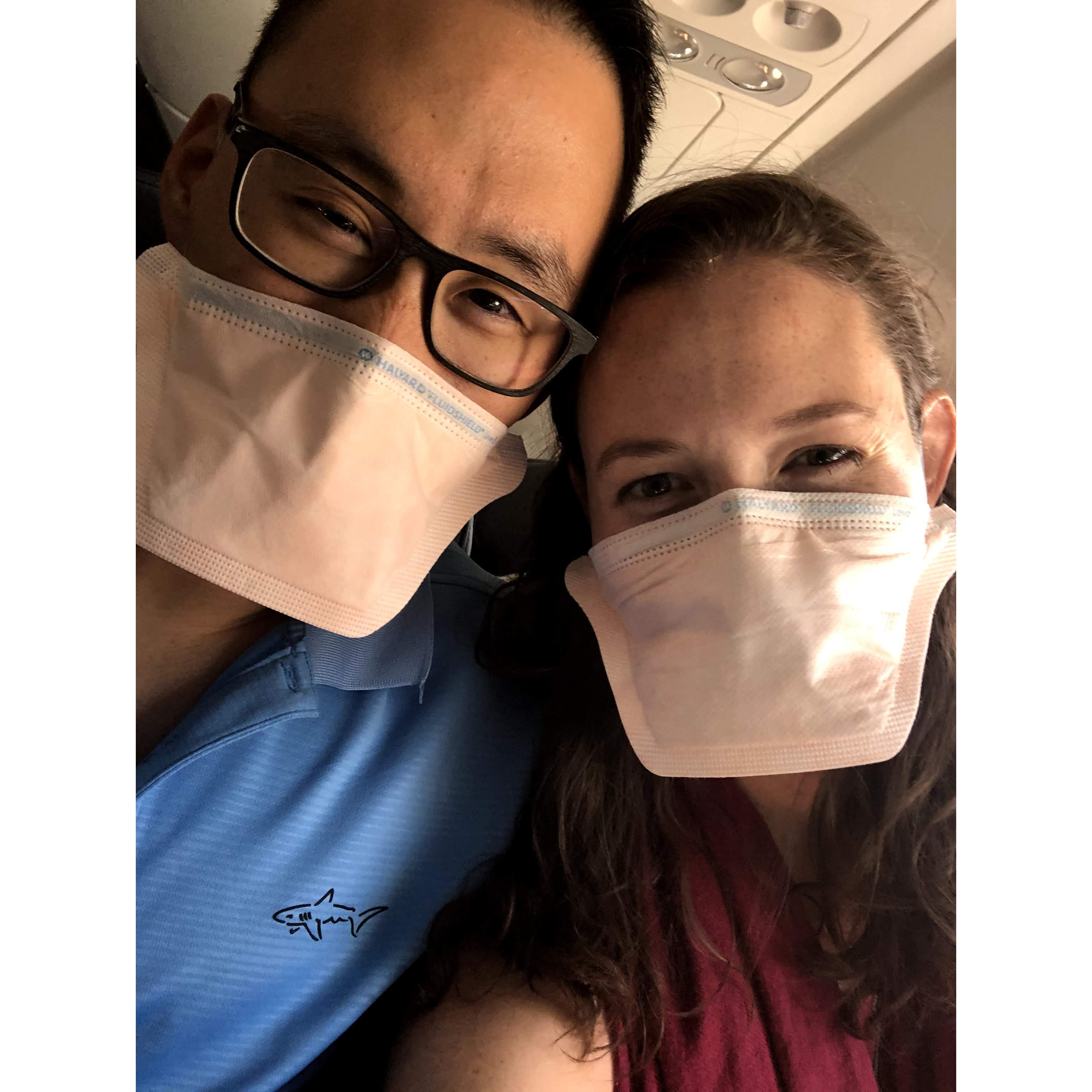 First plane ride together and really enjoying the "Duck bill" mask.