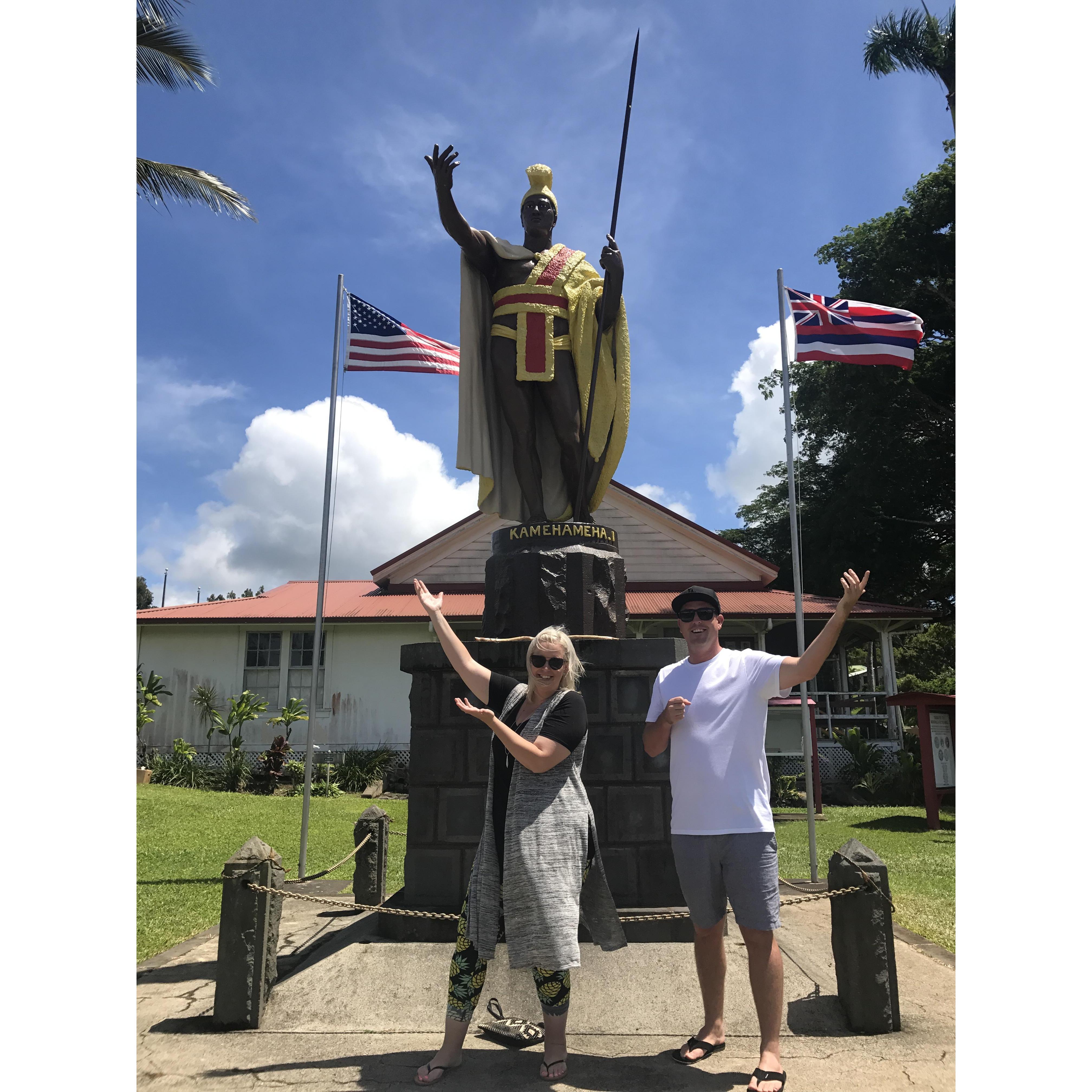Evan and Alia at the Kamehameha statue in the town they grew up in.