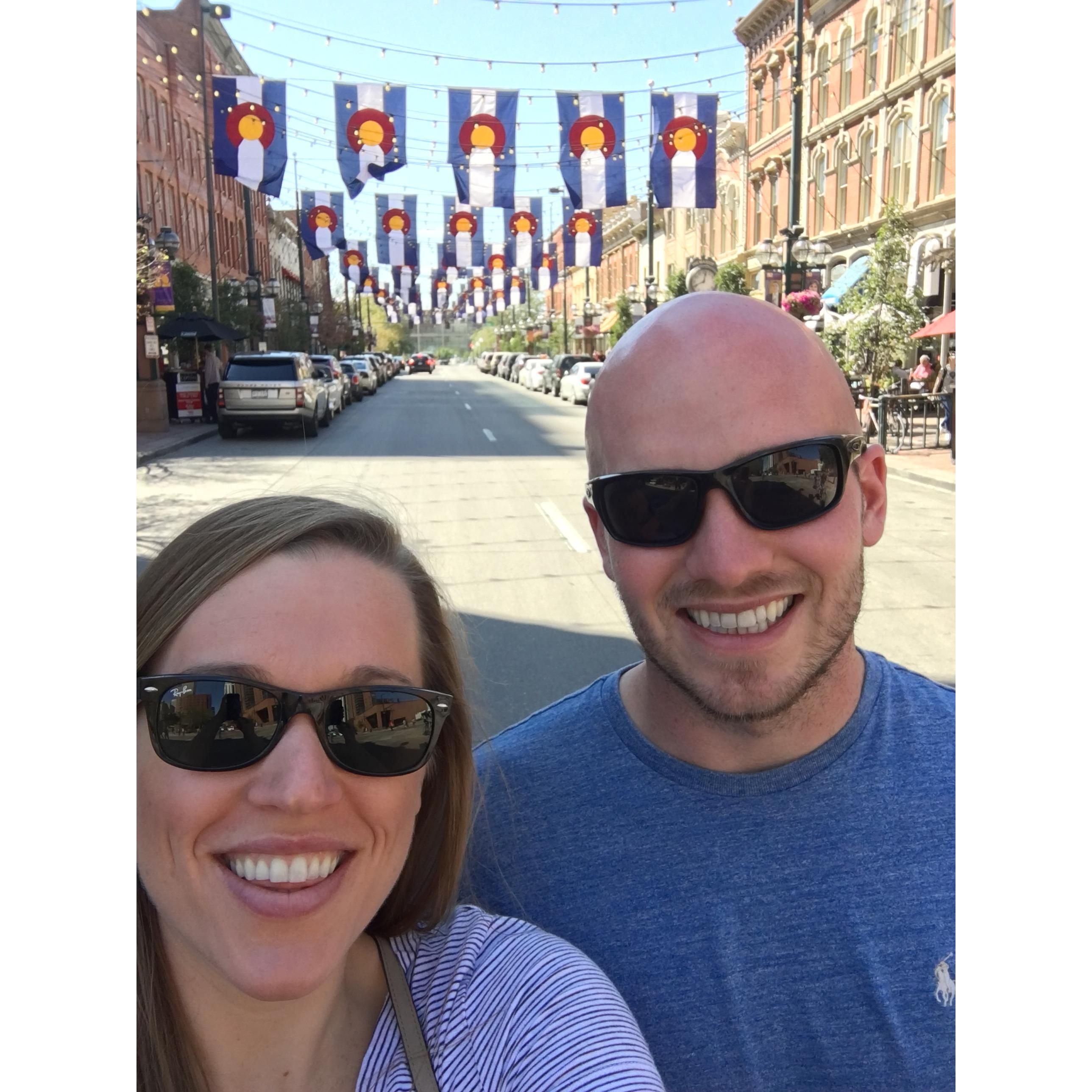 (September 2017) Exploring downtown Denver. Sarah really had to talk Jake into stopping and standing in the middle of the street to take this photo.
