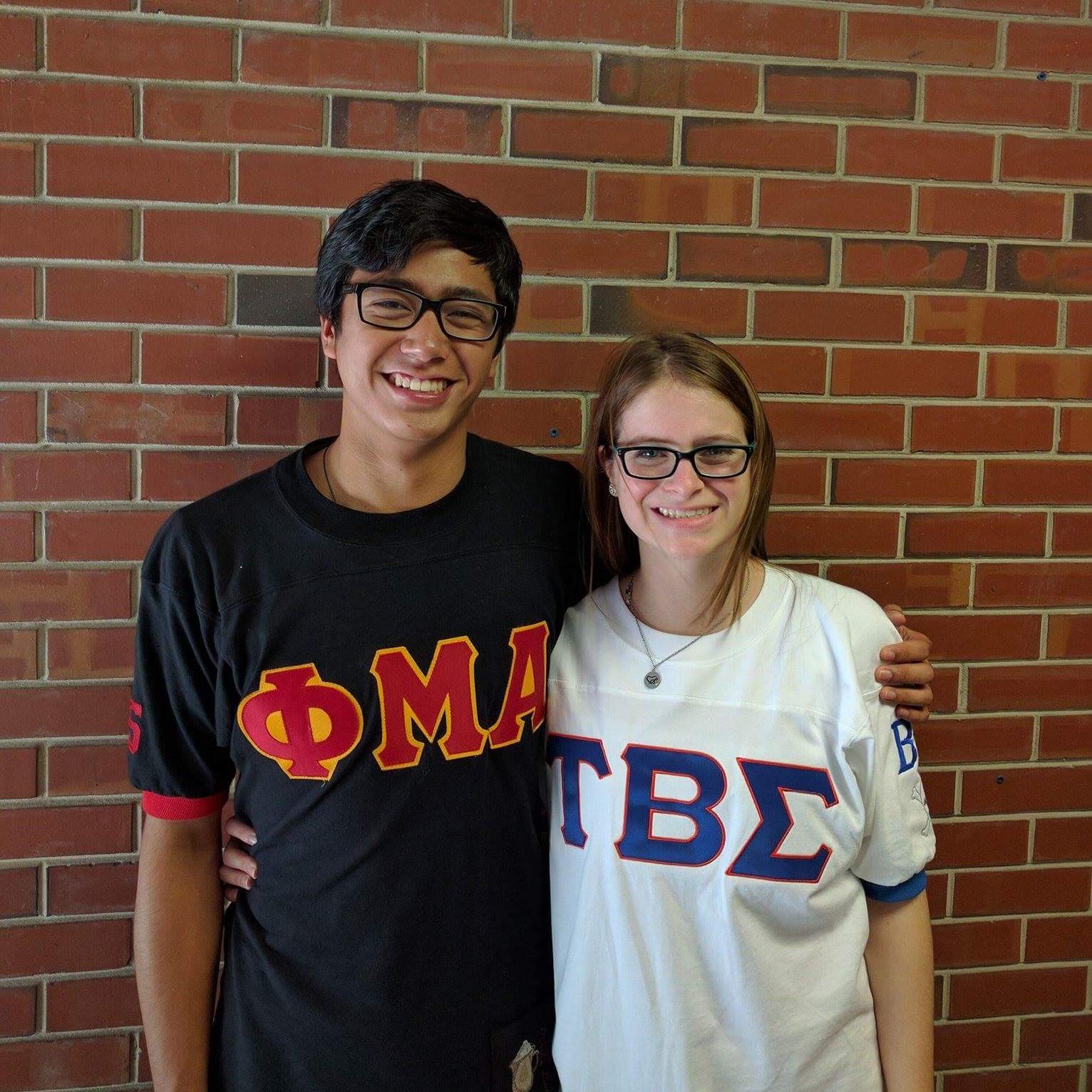 Our first monthiversary. Wearing our respective fraternity/sorority jerseys. 2016.