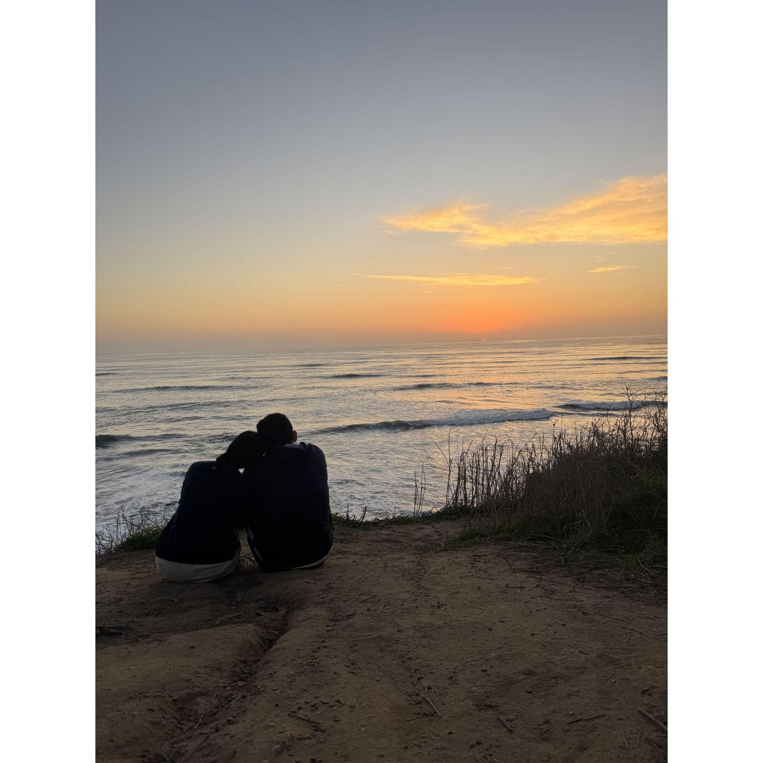 A kind stranger took this photo of us watching the sunset in San Diego.