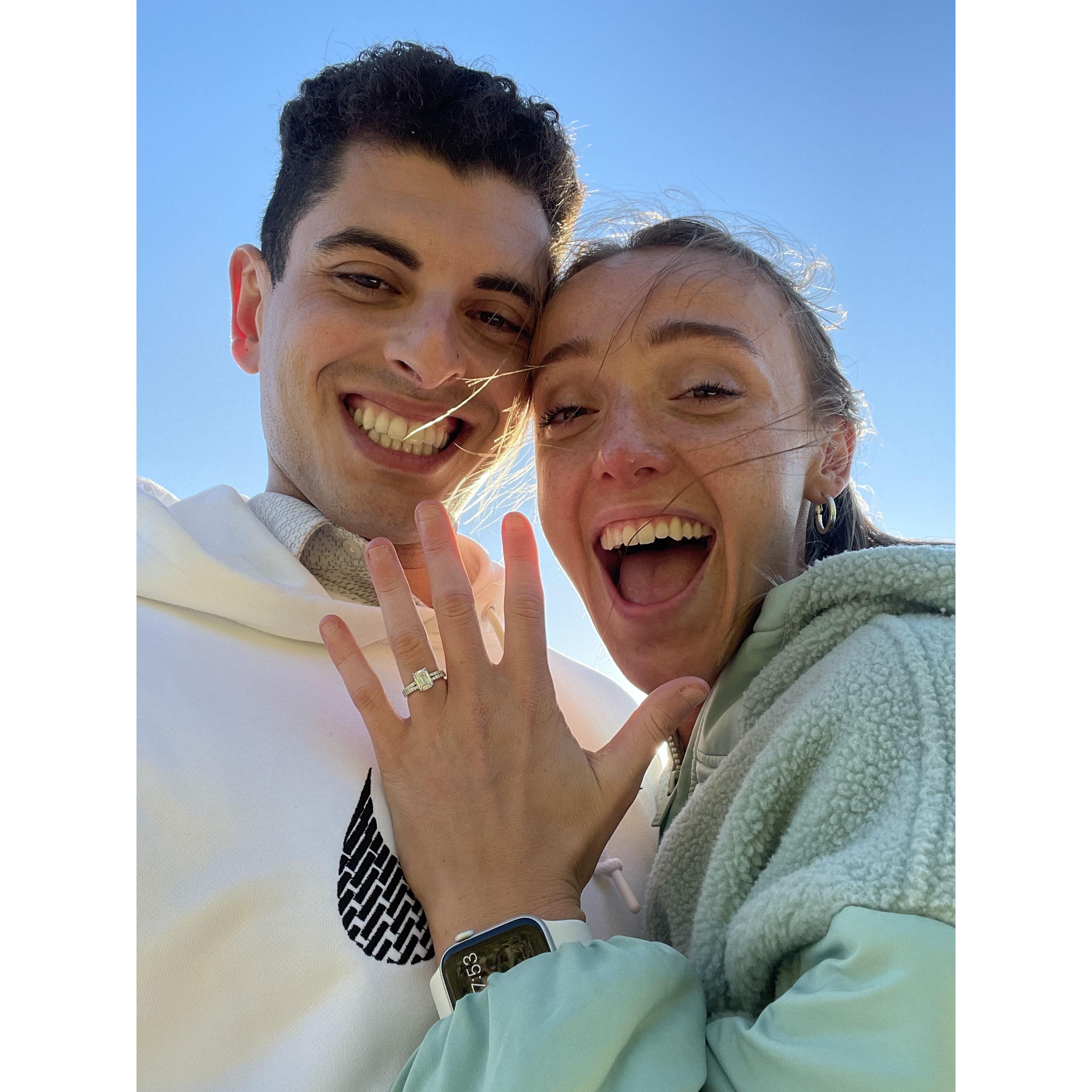 Q surprised Emily with a getaway trip to the coast in July 2023, and a proposal!