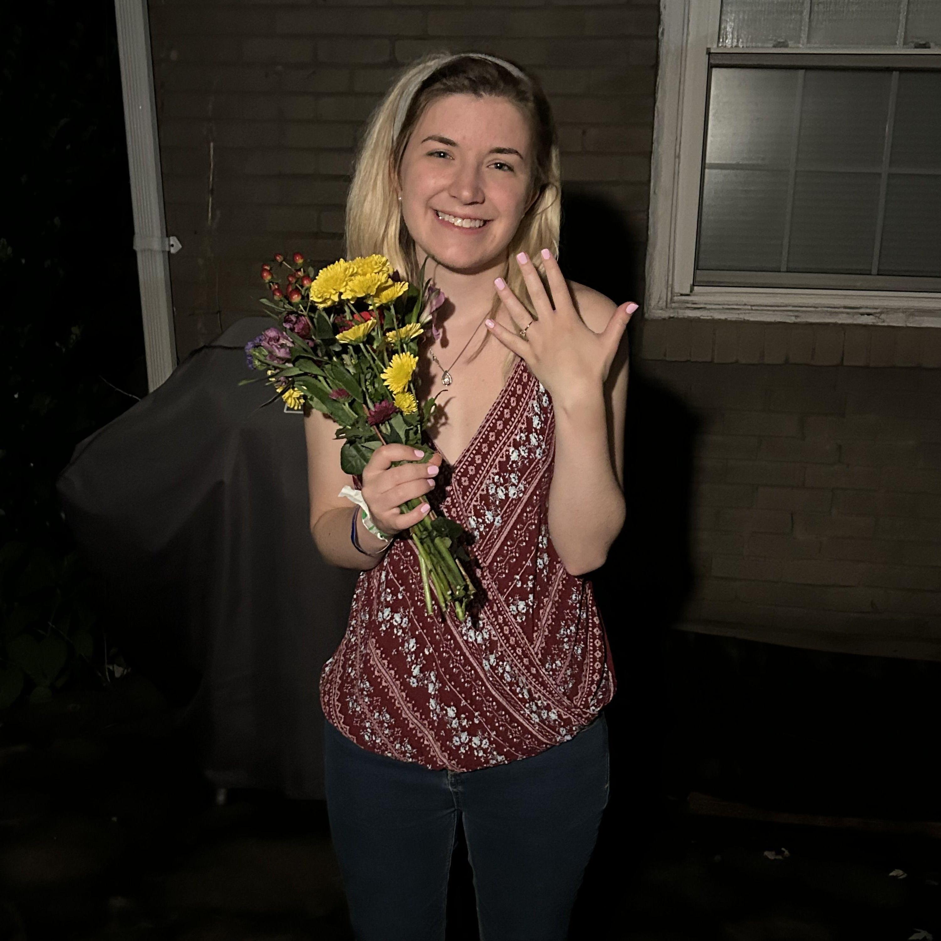 On July 20th, Cate was at a Sounds Game and thought that Alex was in Lexington working on a paper. However, Alex had driven down to surprise her earlier that day and proposed on her back porch when she came home.