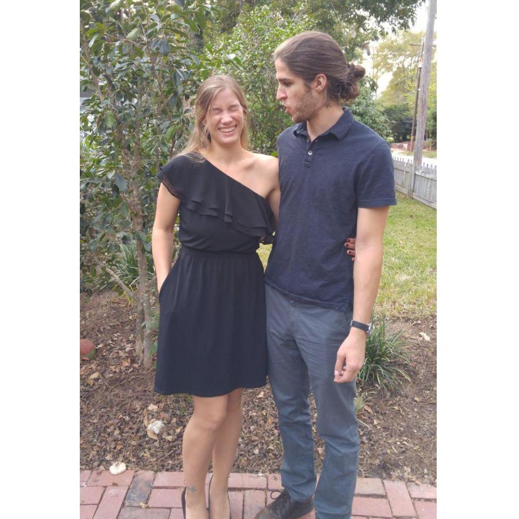 Laughing after I realized that David was hiding a slice of pizza behind my back for the picture