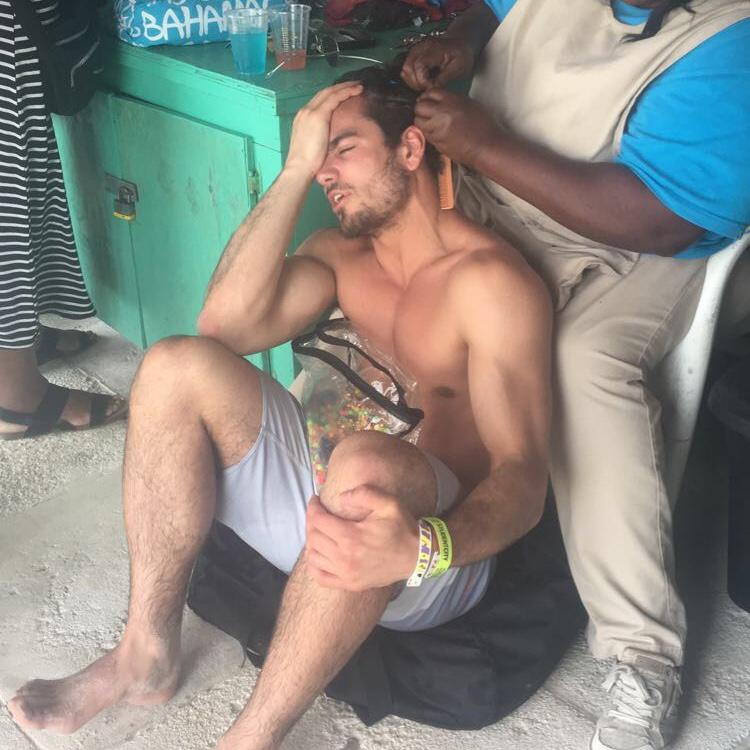 Spring Break senior year- johnny getting cornrows