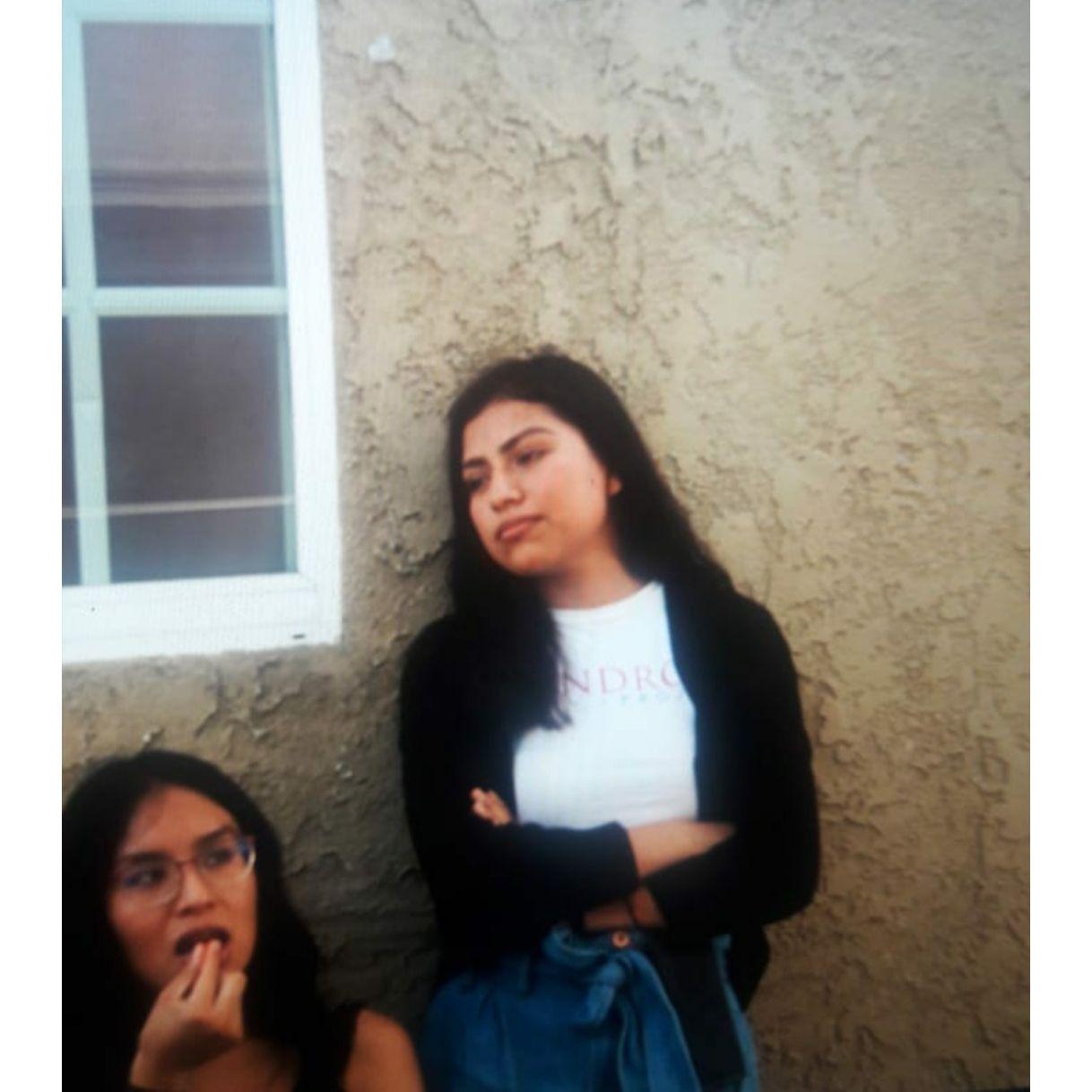 Alan had a crush on Melina. Alan would take pictures of her.