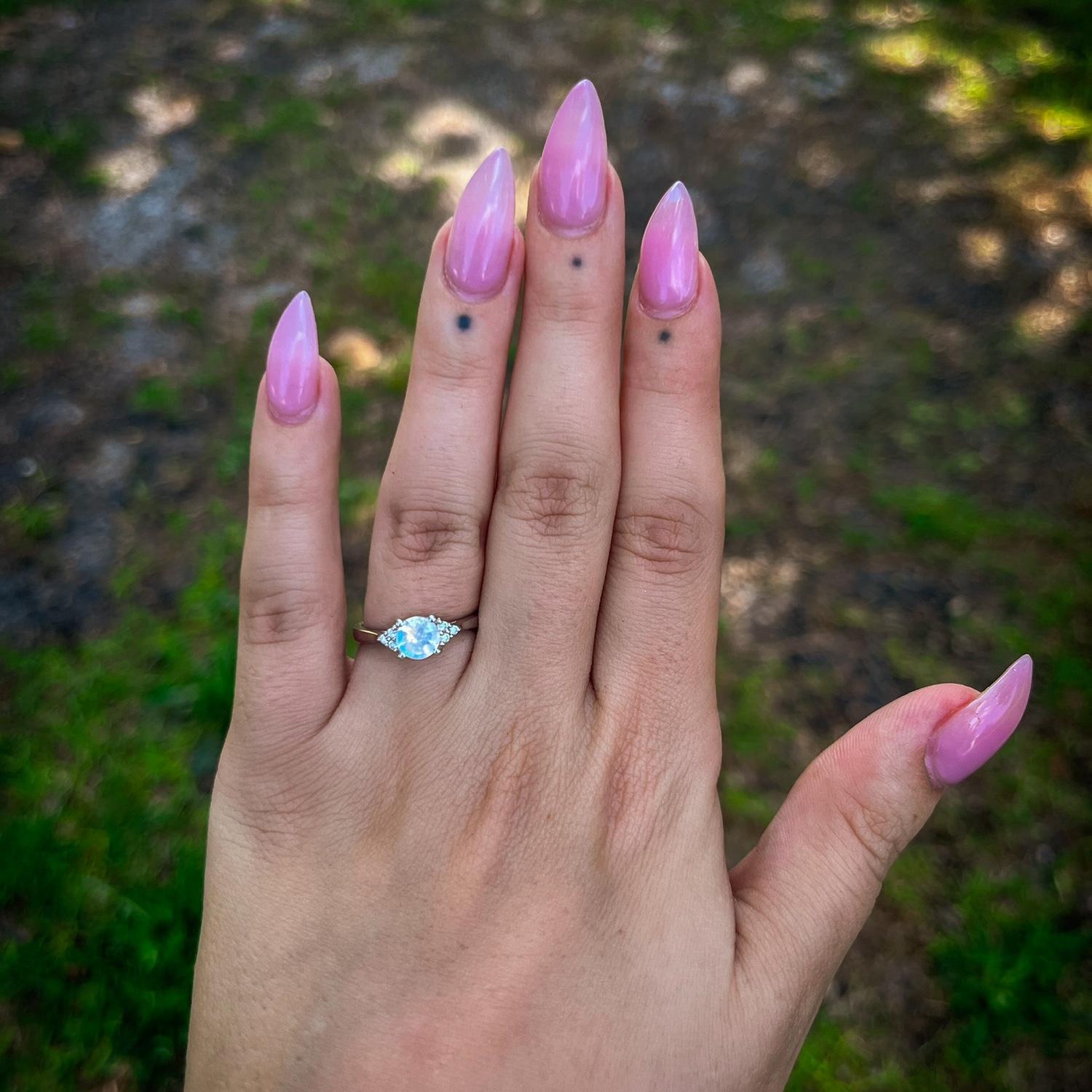 The ring: beautiful white gold, moonstone, and diamonds