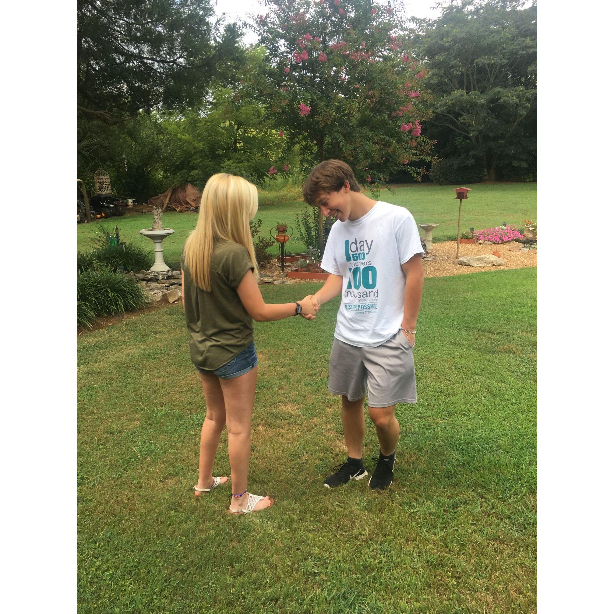 We recreated this photo for our 1 year anniversary because after Ethan asked me to be his gf he shook my hand LOL