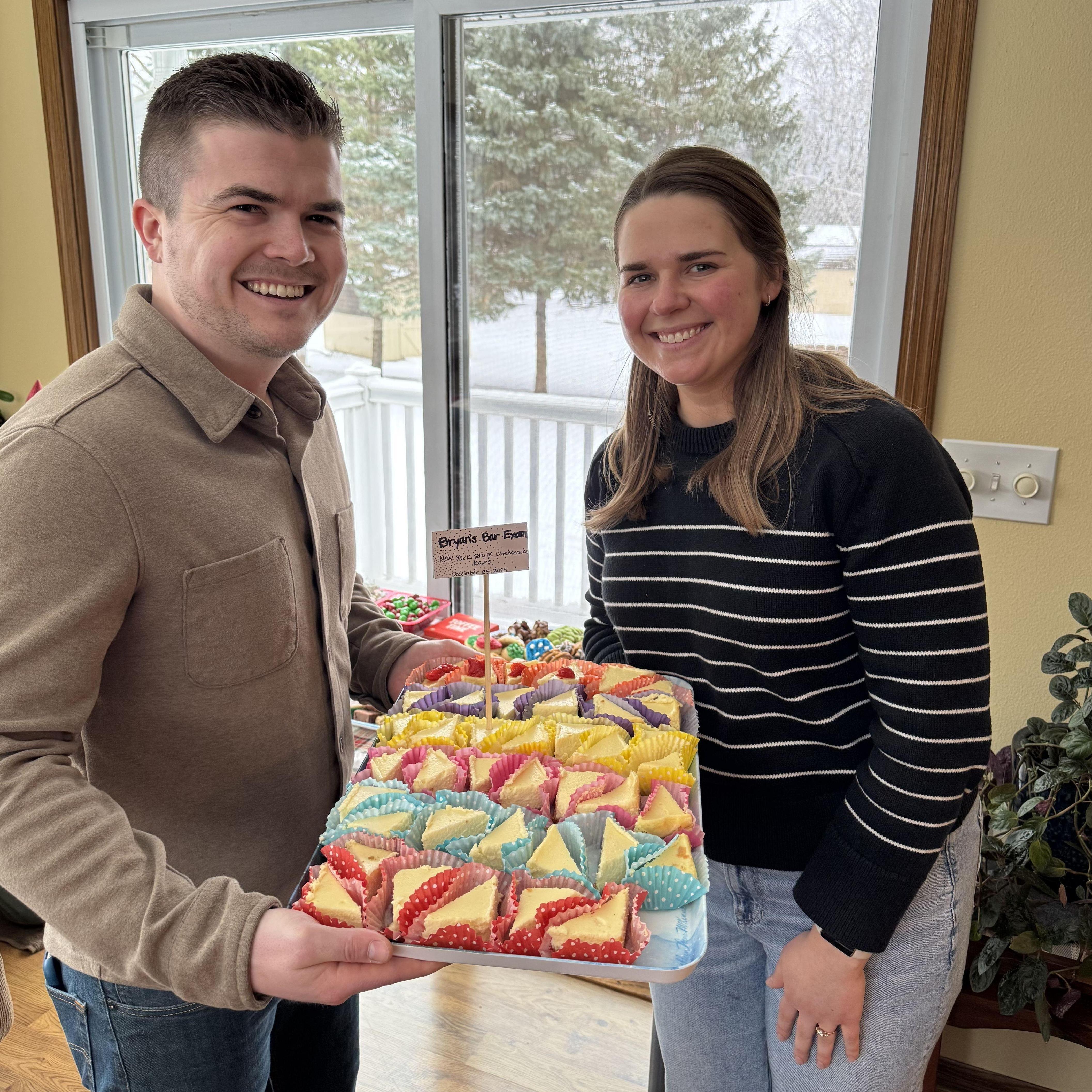 Abbie's family has a rule that any new member has to first pass the "bar exam". Bryan made cheesecake bars and presented them to everyone at Christmas.
We are happy to report he passed!