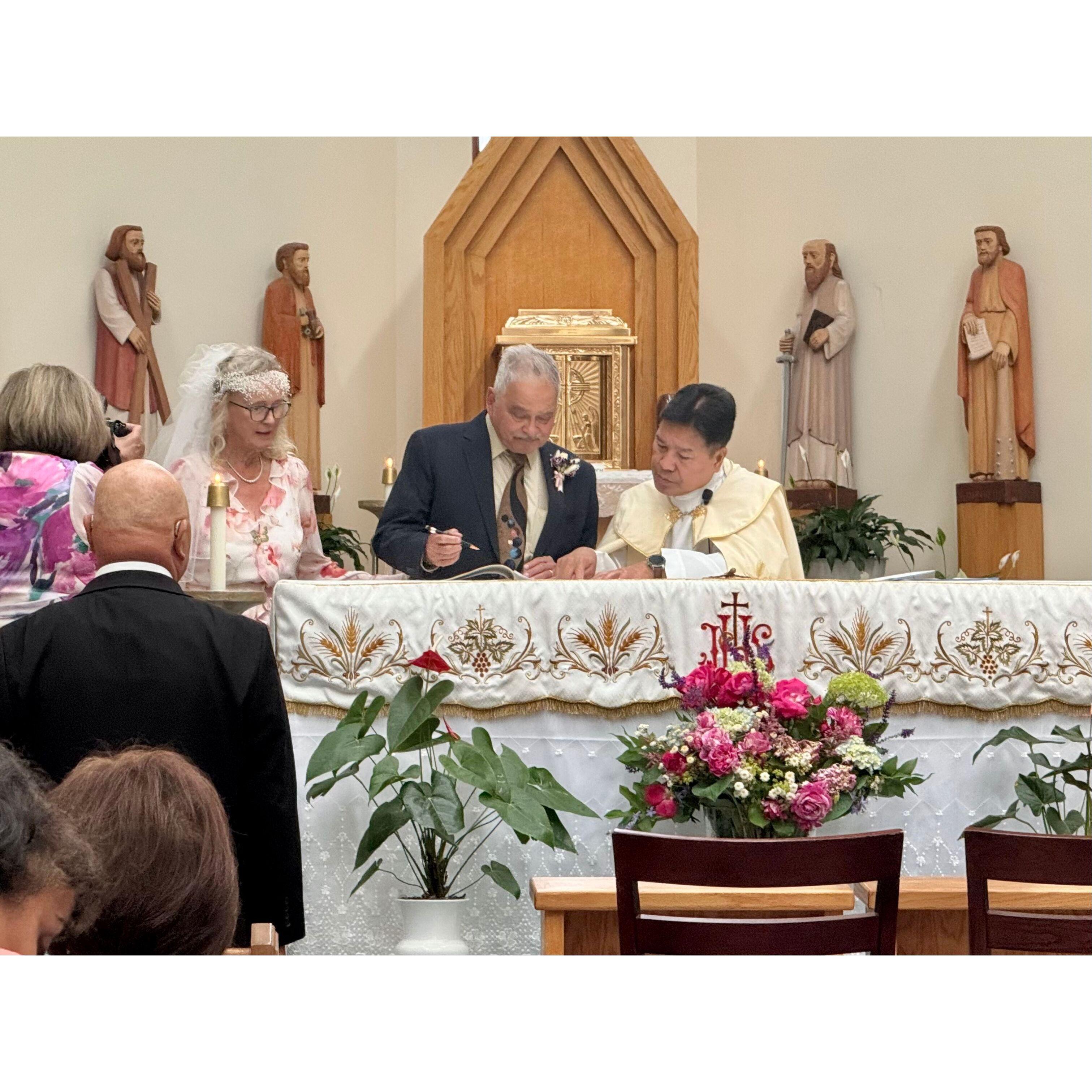 Leonard signs the register.
