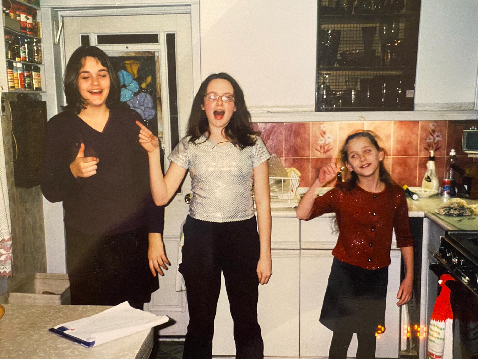 Julia, Caroline and Lisa Anne dancing to NSync or Backstreet Boys for their Babci.