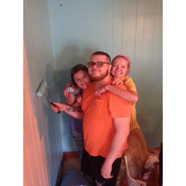 A very grainy picture of us and Rachel painting the house together