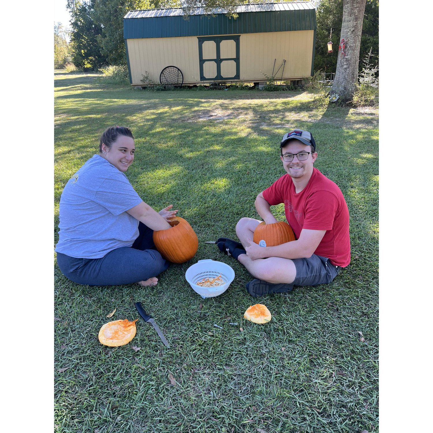 His first time carving Pumpkins. Gotta get all the guts out!