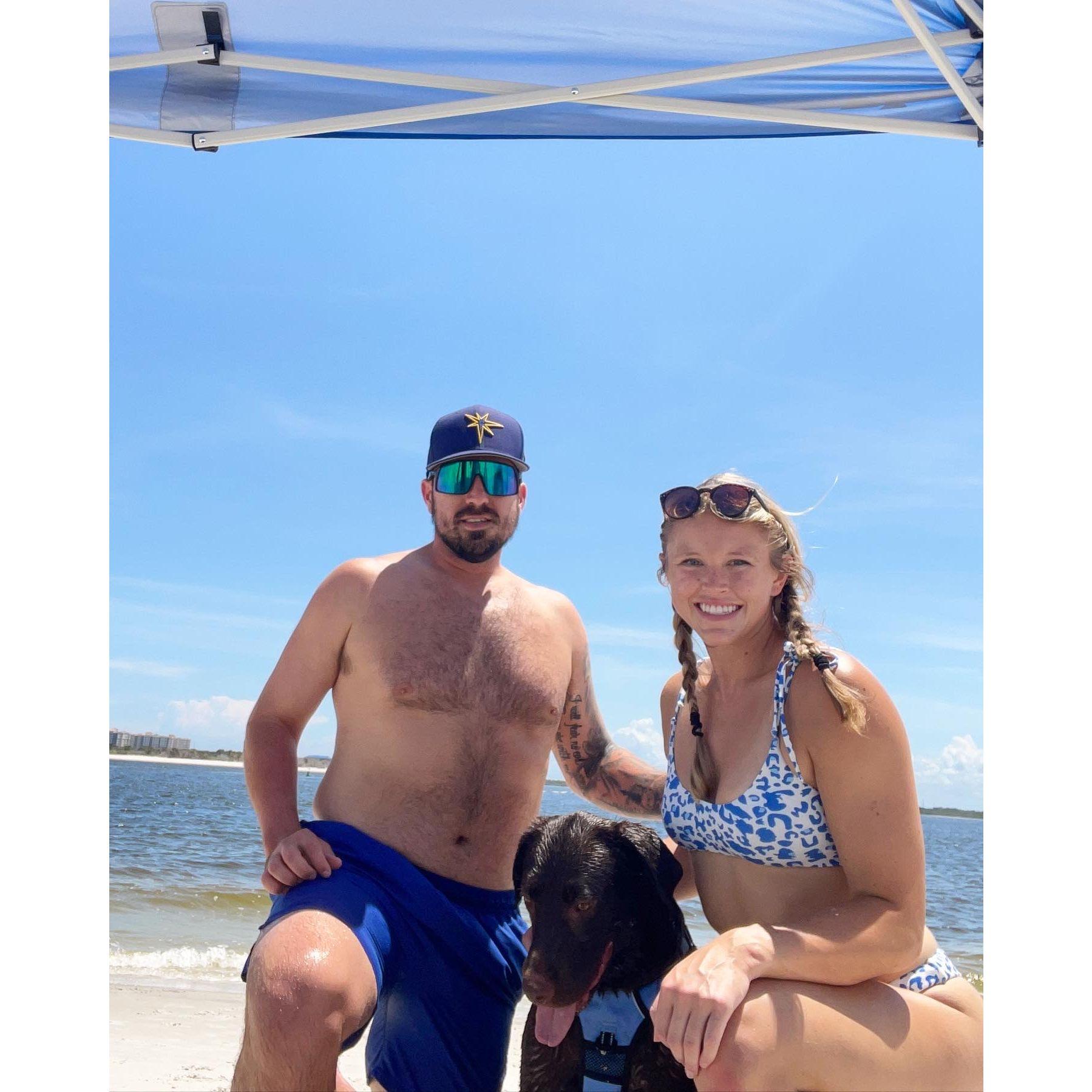 Beach day with our child! He loves playing in the sand, but not so much the water!