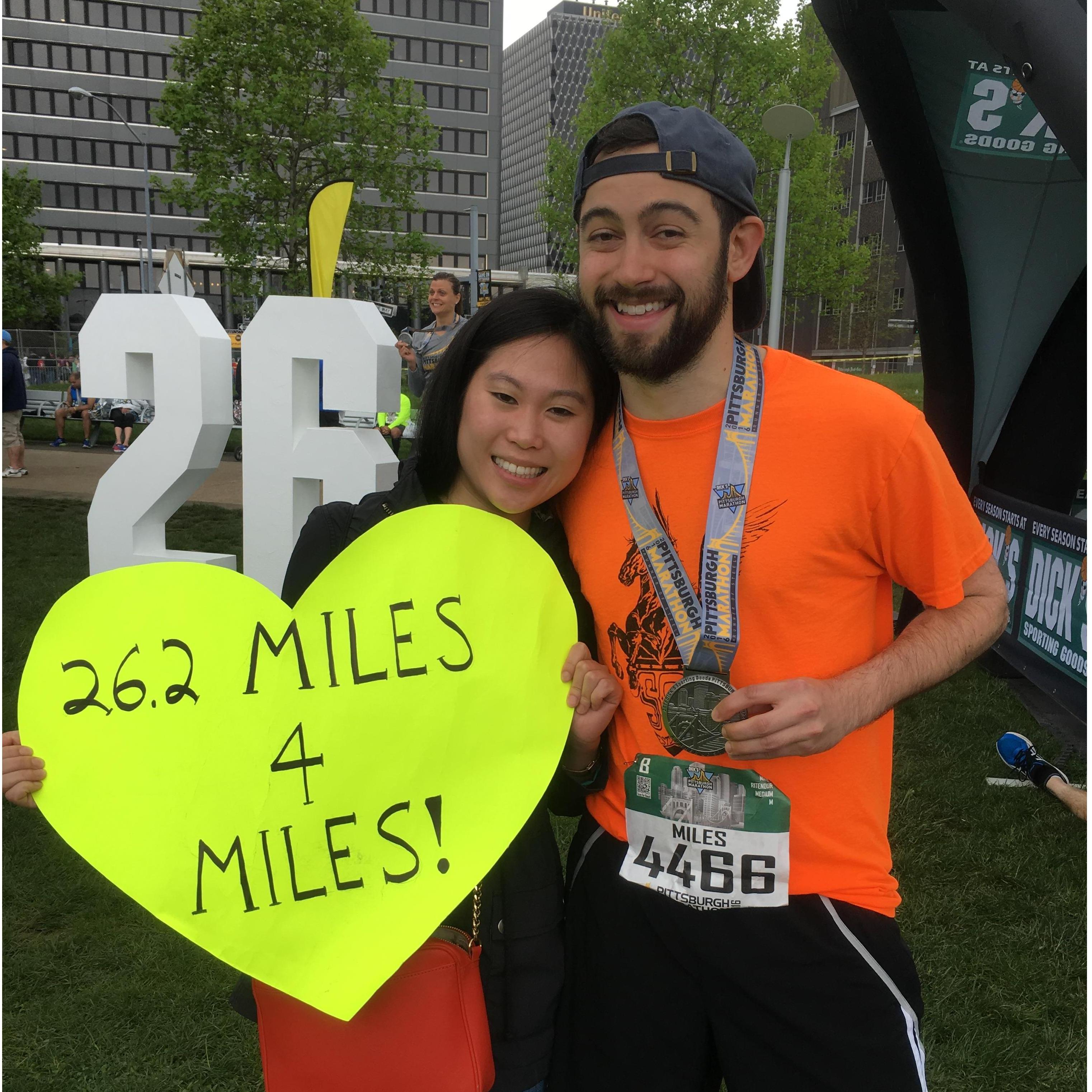 Miles first marathon - Amy with the A+ sign game