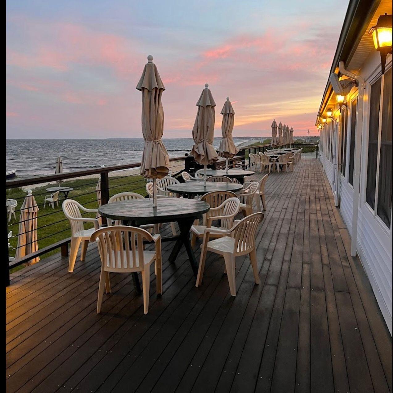 Outdoor seating on the deck of The Lighthouse Inn.
