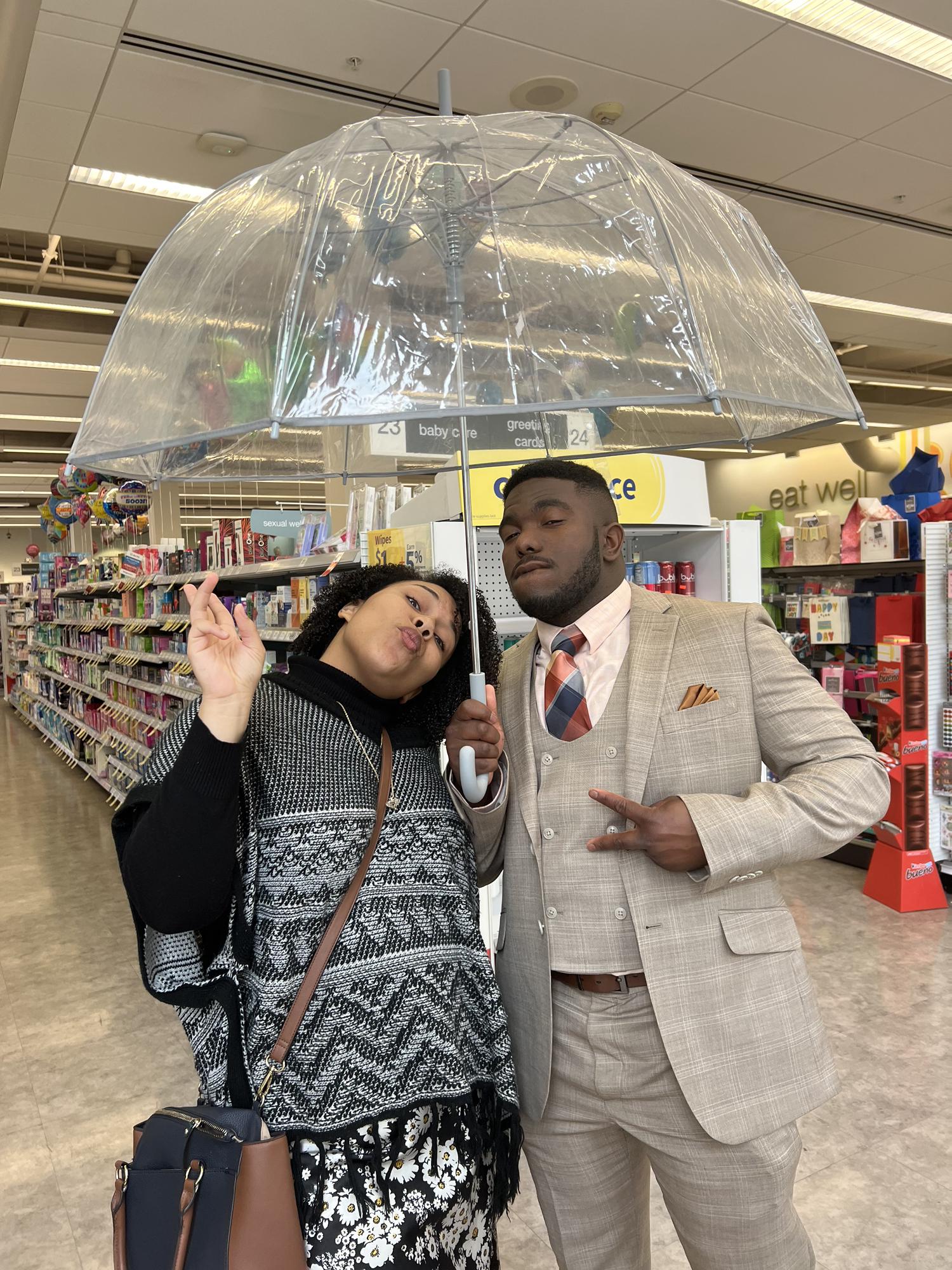 Moments before the Proposal(at wall-greens for umbrellas for the rain)