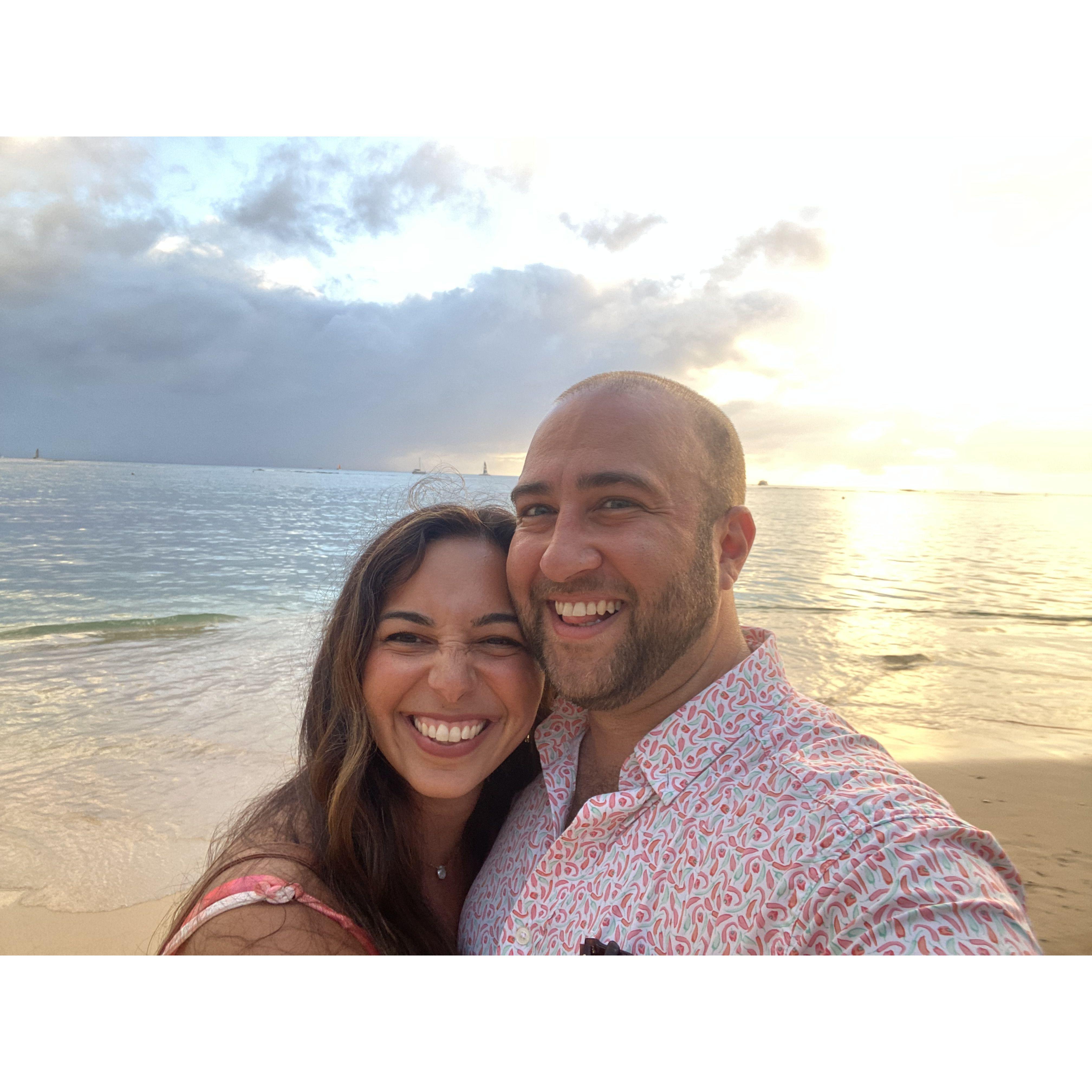 right before the proposal, enjoying the sunset on beautiful Waikiki beach