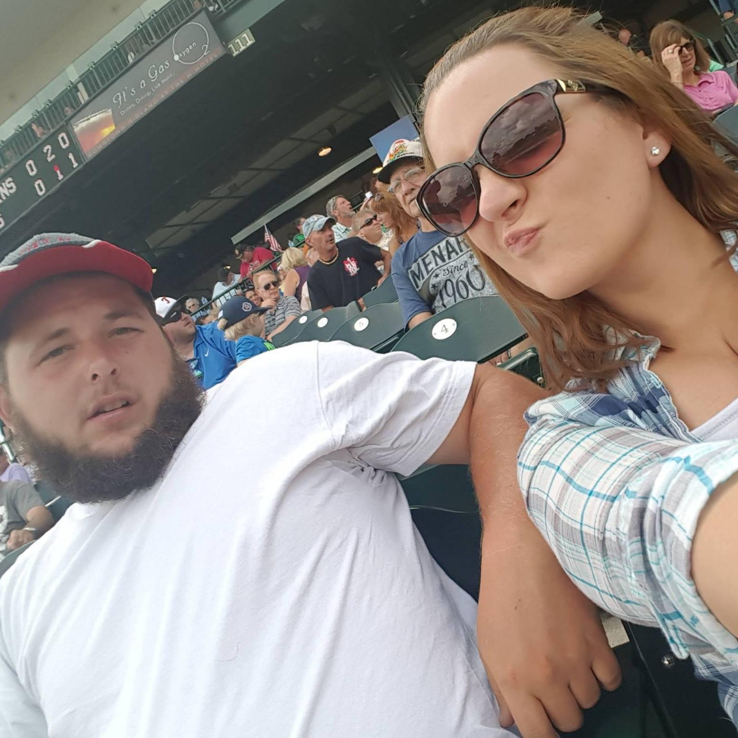 We love to go to baseball games, like our local minor league team the Great Lakes Loons... but Travis doesn't understand Sarah's need to take pics all the time!