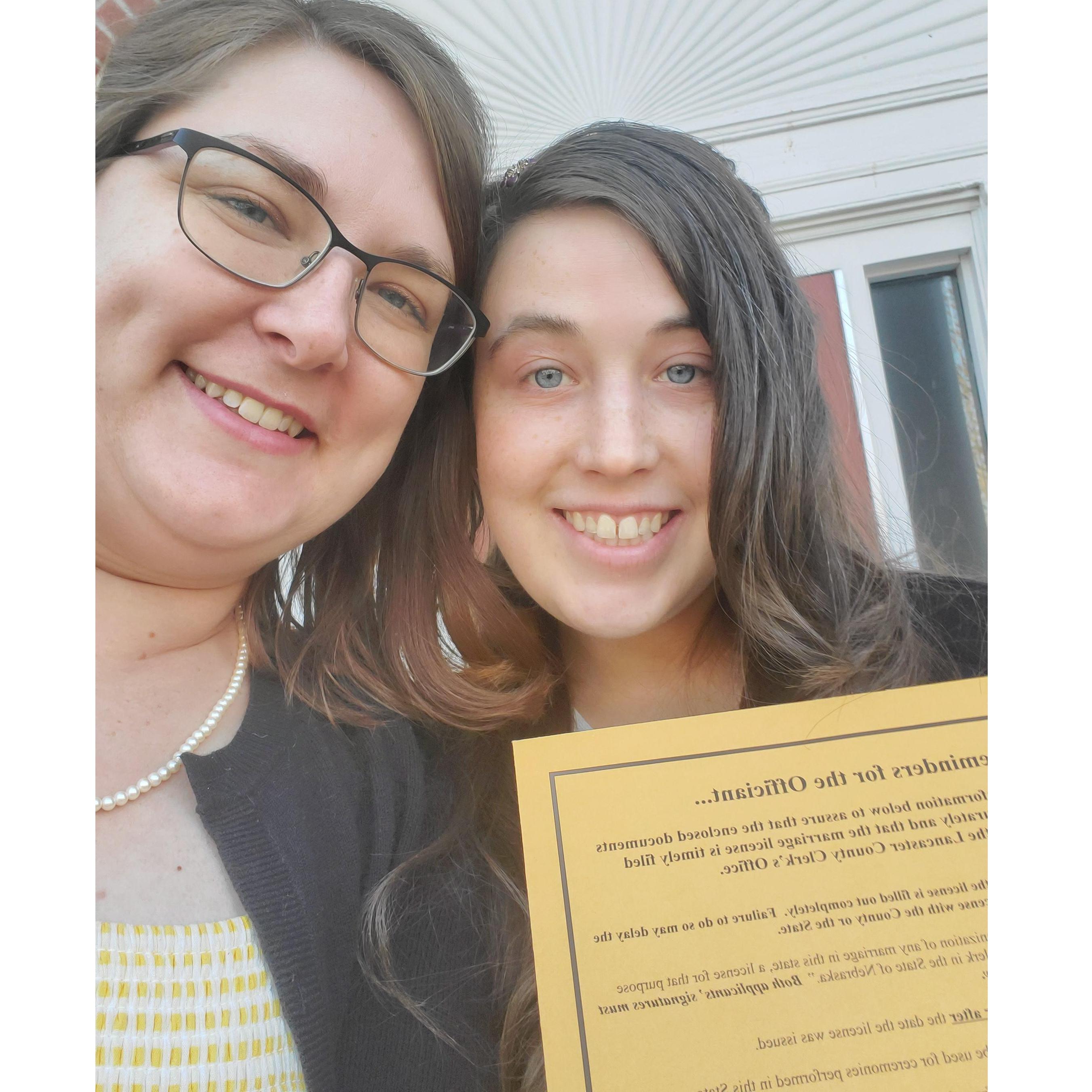 Us with our marriage license. Getting a marriage license with the virus going on was quite the adventure.