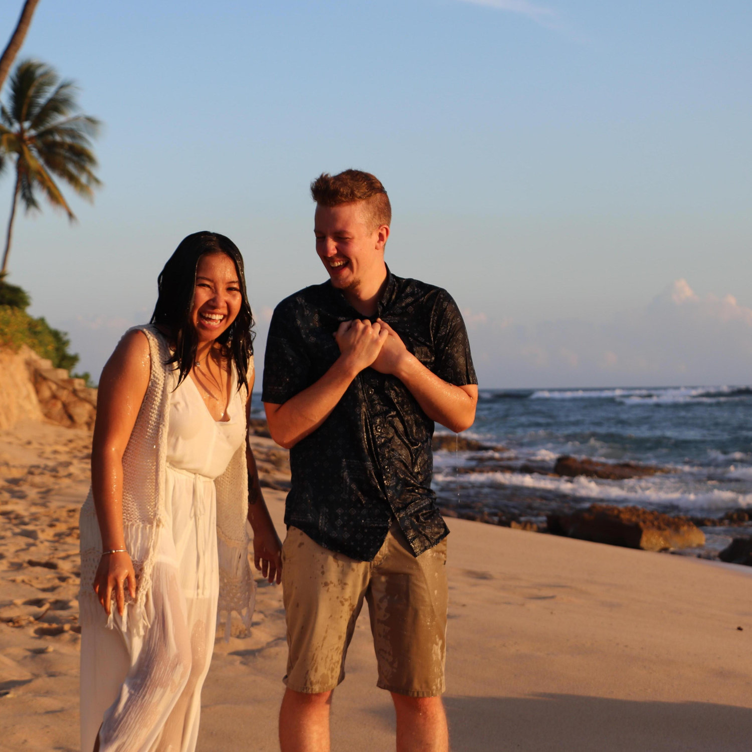 Getting soaked during our engagement pics at Maili, Hawaii