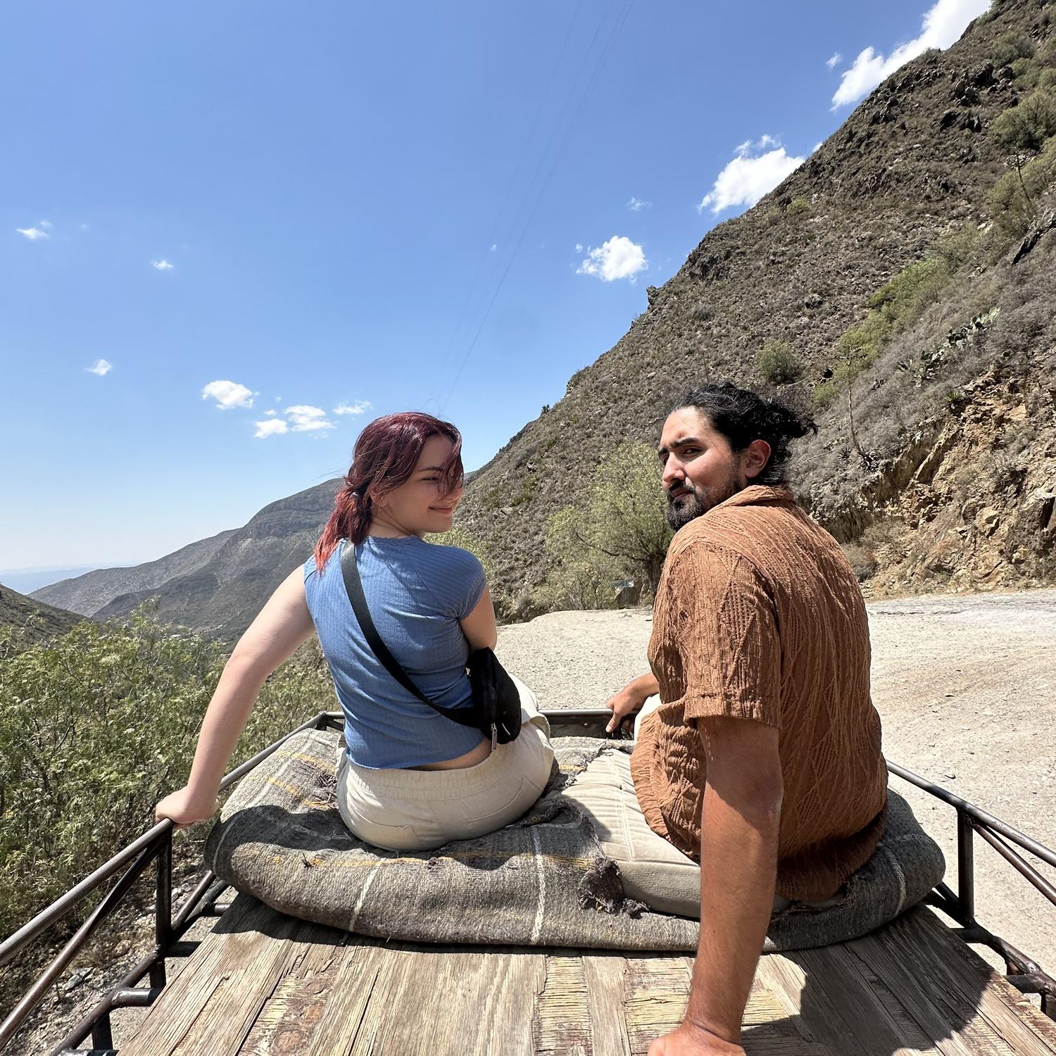 riding on top of a willys on the side of a mountain in mexico