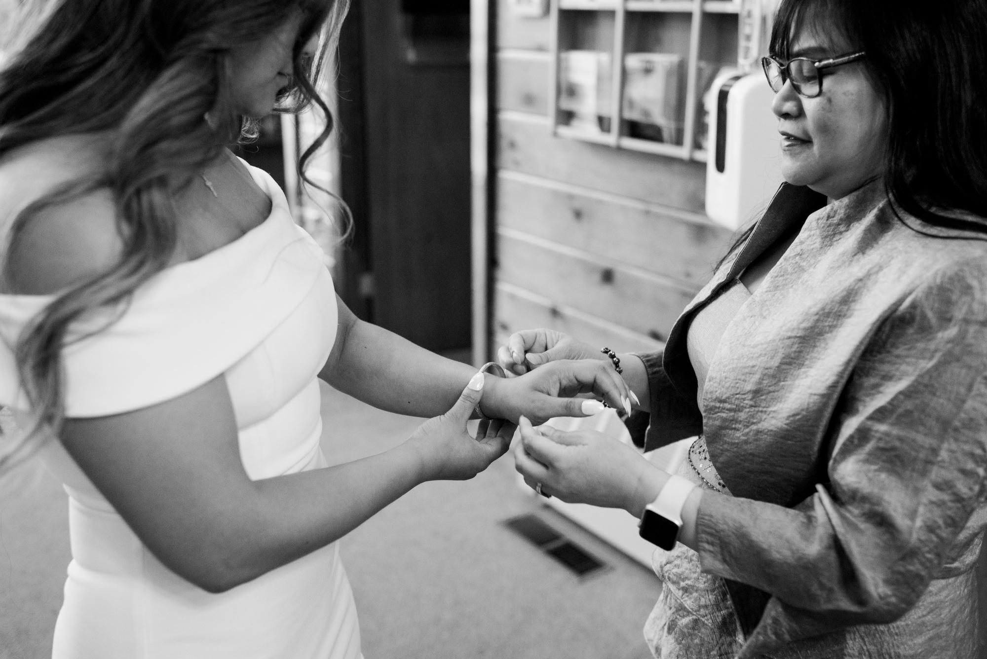 Jamie’s mom helping her out on her grandmother’s bracelet