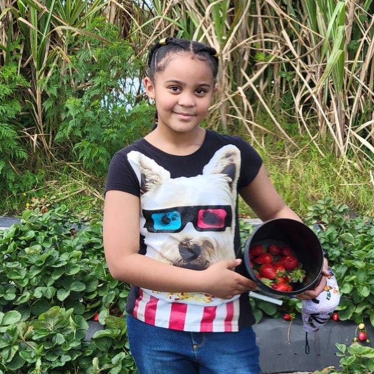 A more recent pic of Athena picking strawberries.