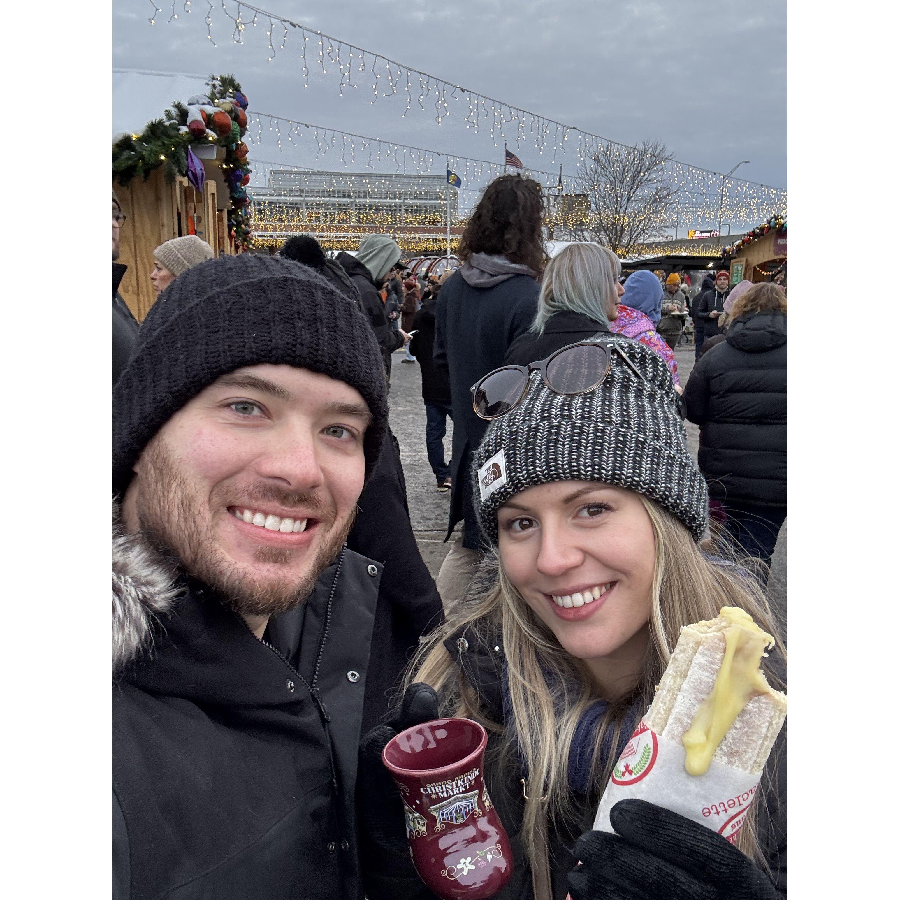 Our first time at the Grand Rapids Christkindl Markt, enjoying mulled wine and fresh raclette!