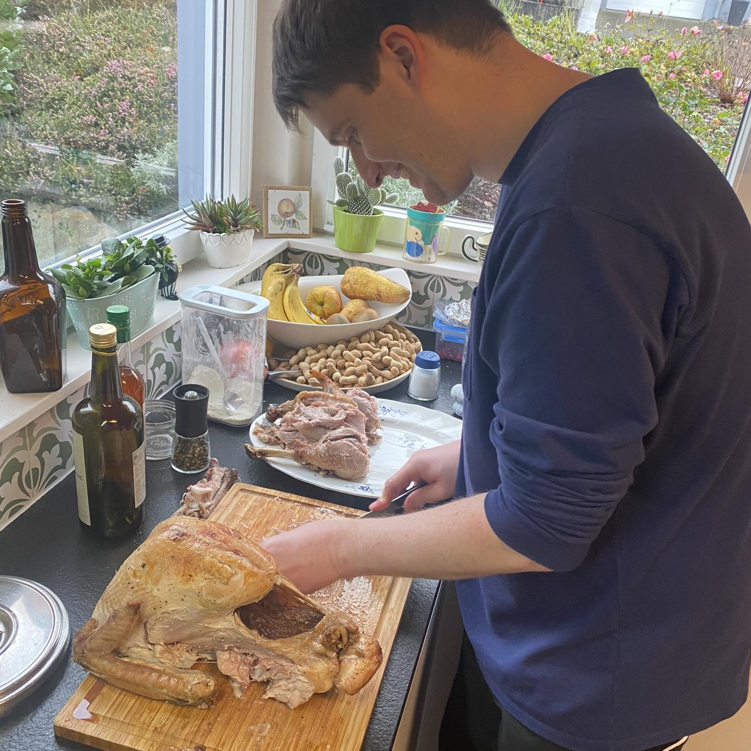 An American right of passage, Rick carving his first Thanksgiving turkey, November 2023