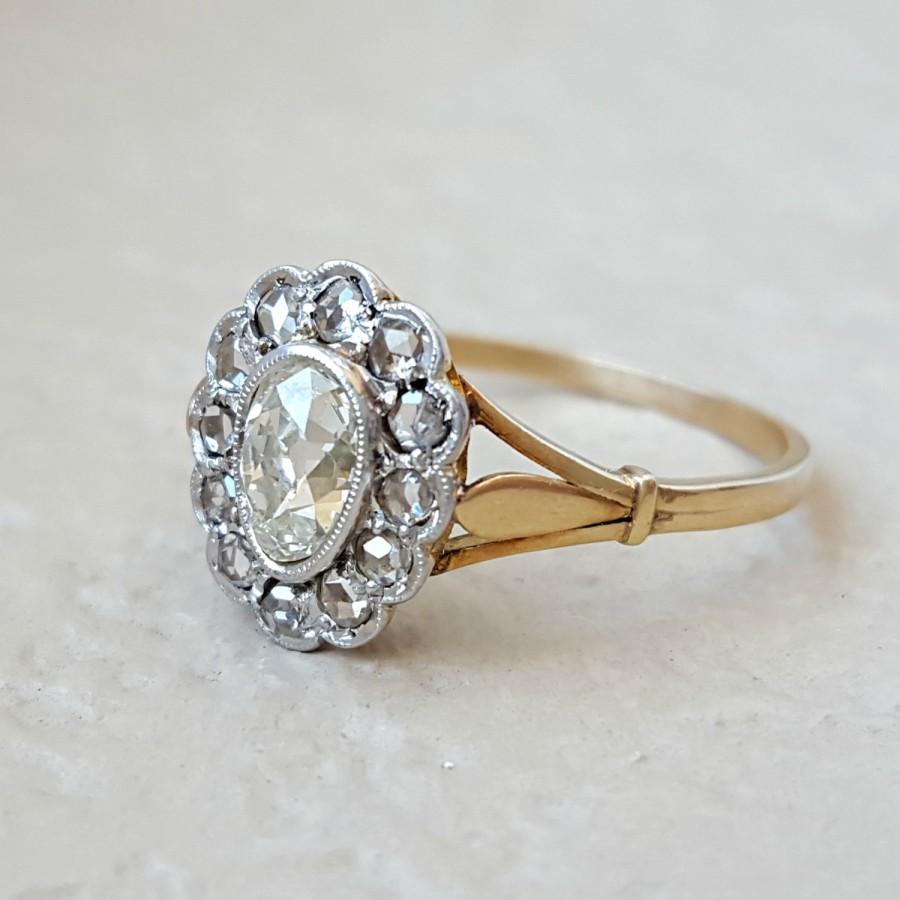 A lovely Victorian/Edwardian-style ring, a gold band set with diamonds arranged in a flower-like cluster